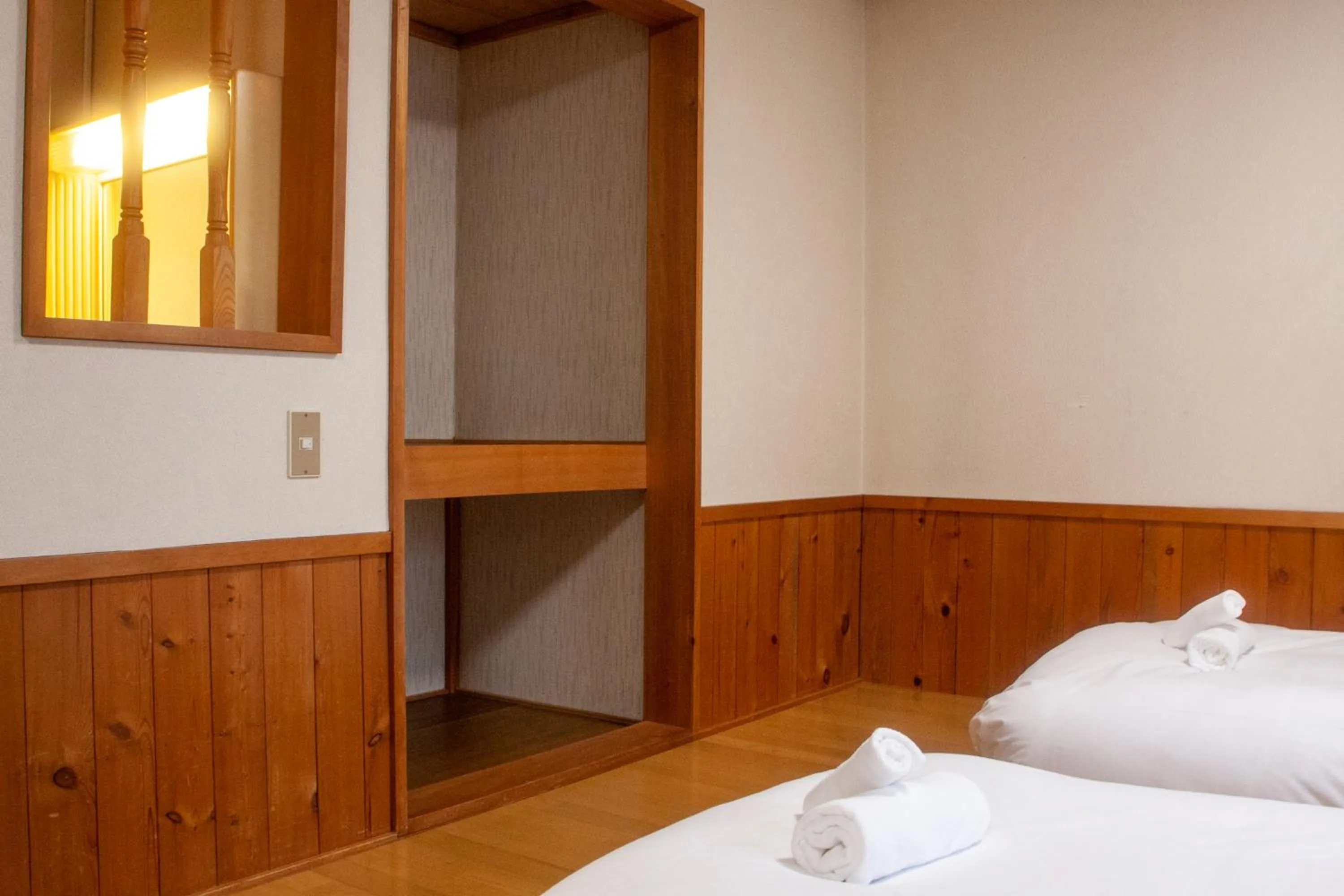 Bed in Kizuna Lodge & BBQ Centre