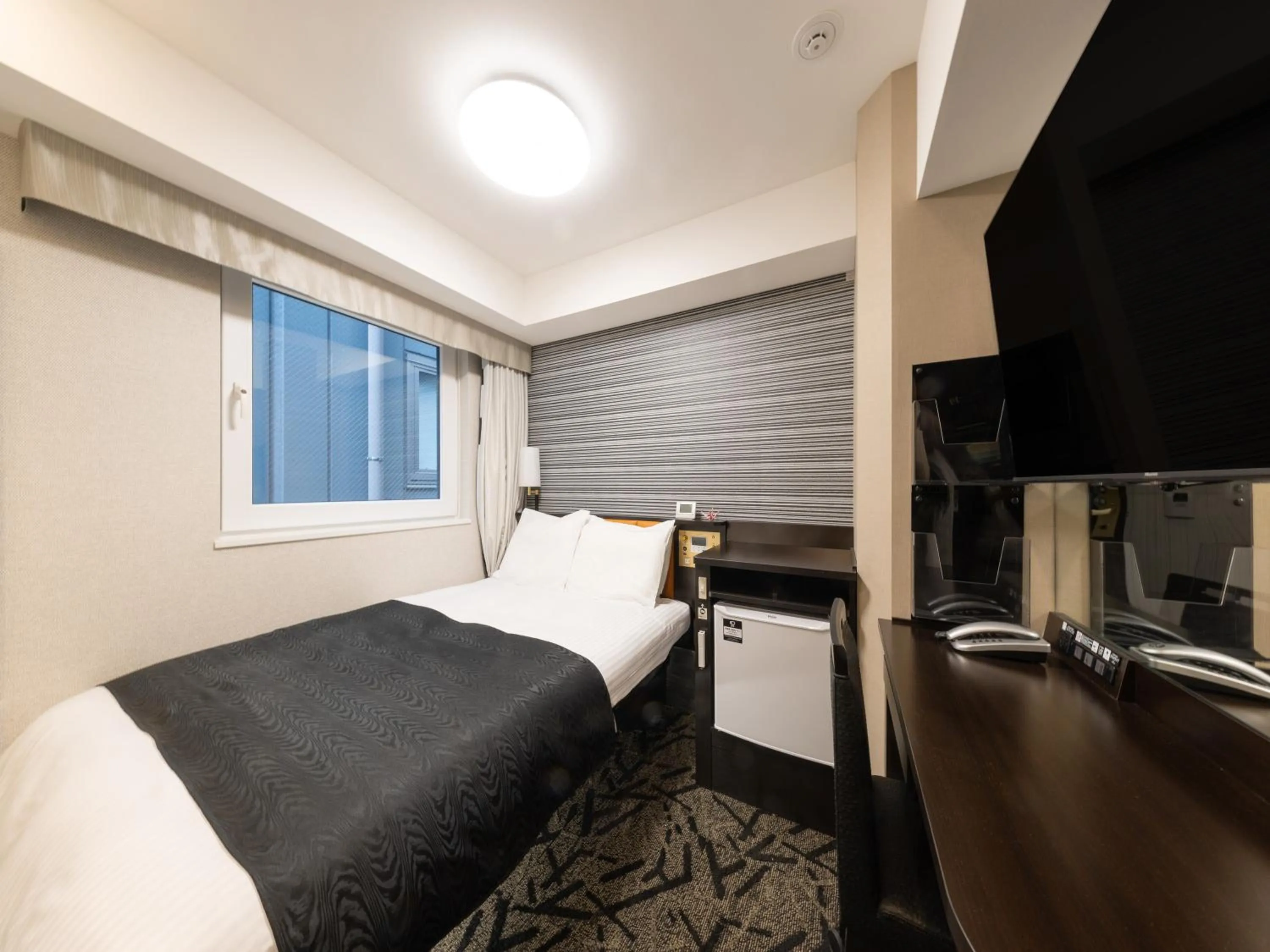 Photo of the whole room, Bed in APA Hotel Shibuya Dogenzakaue