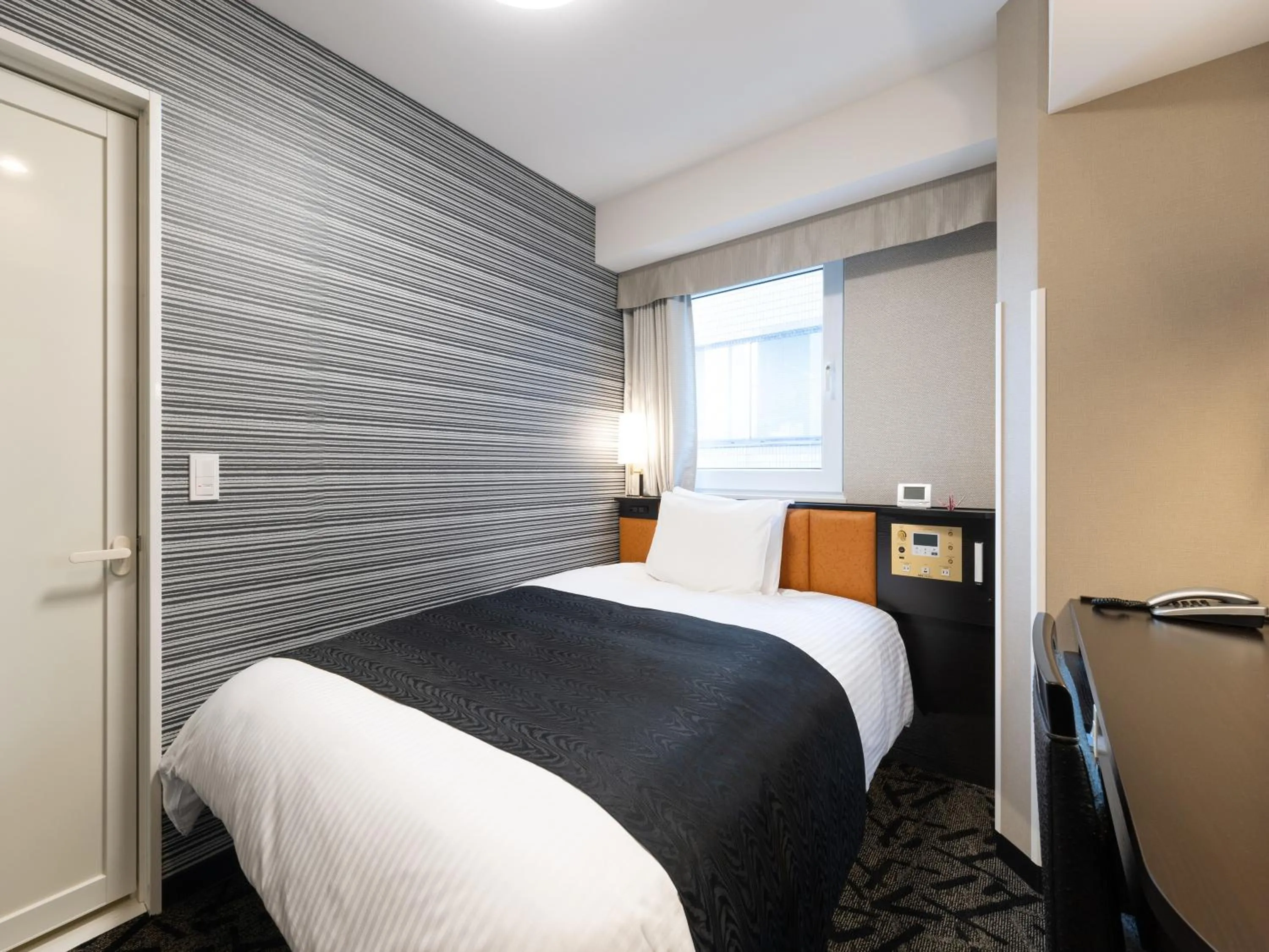 Photo of the whole room, Bed in APA Hotel Shibuya Dogenzakaue