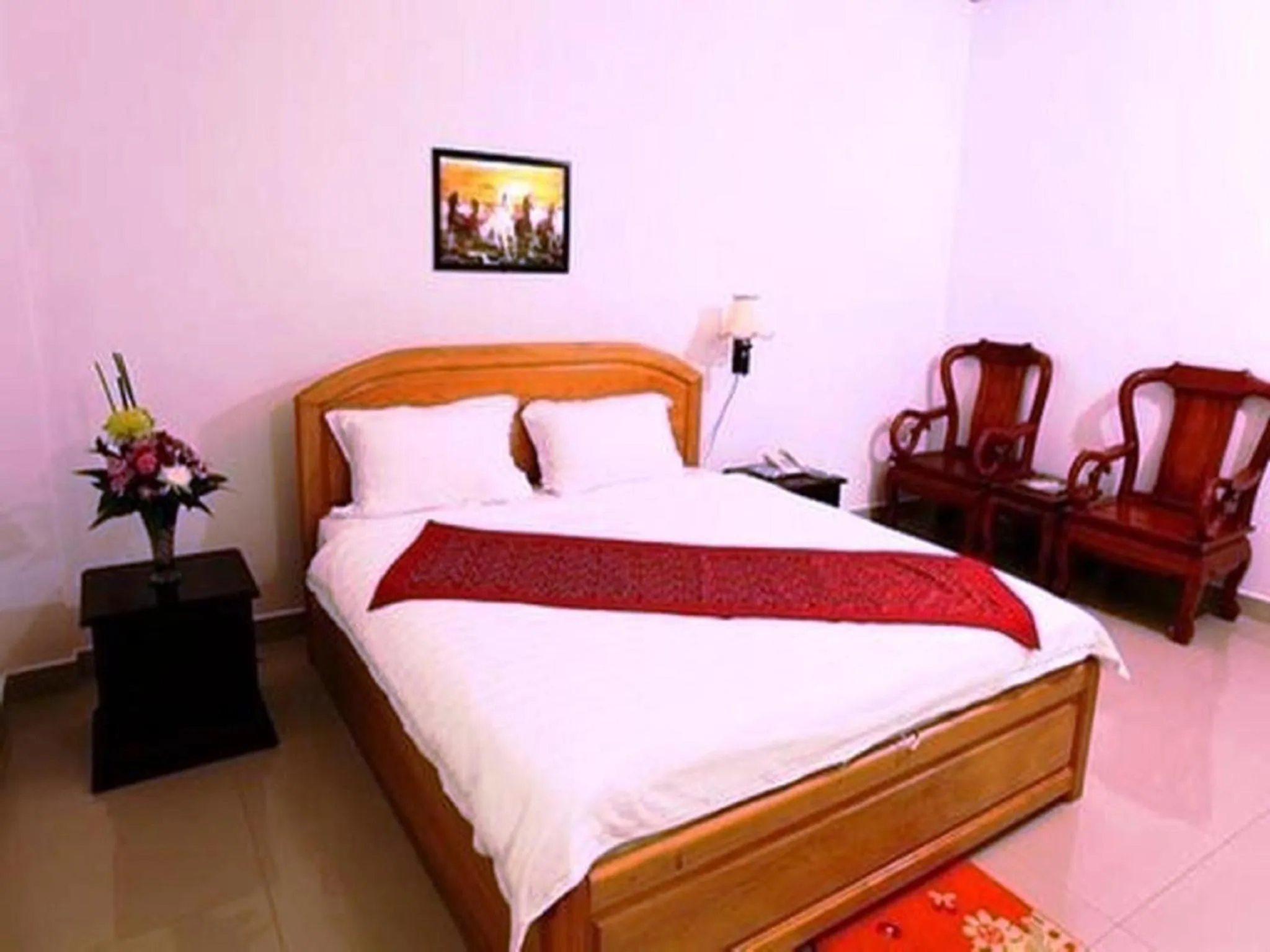 Bed in Douangpraseuth Hotel