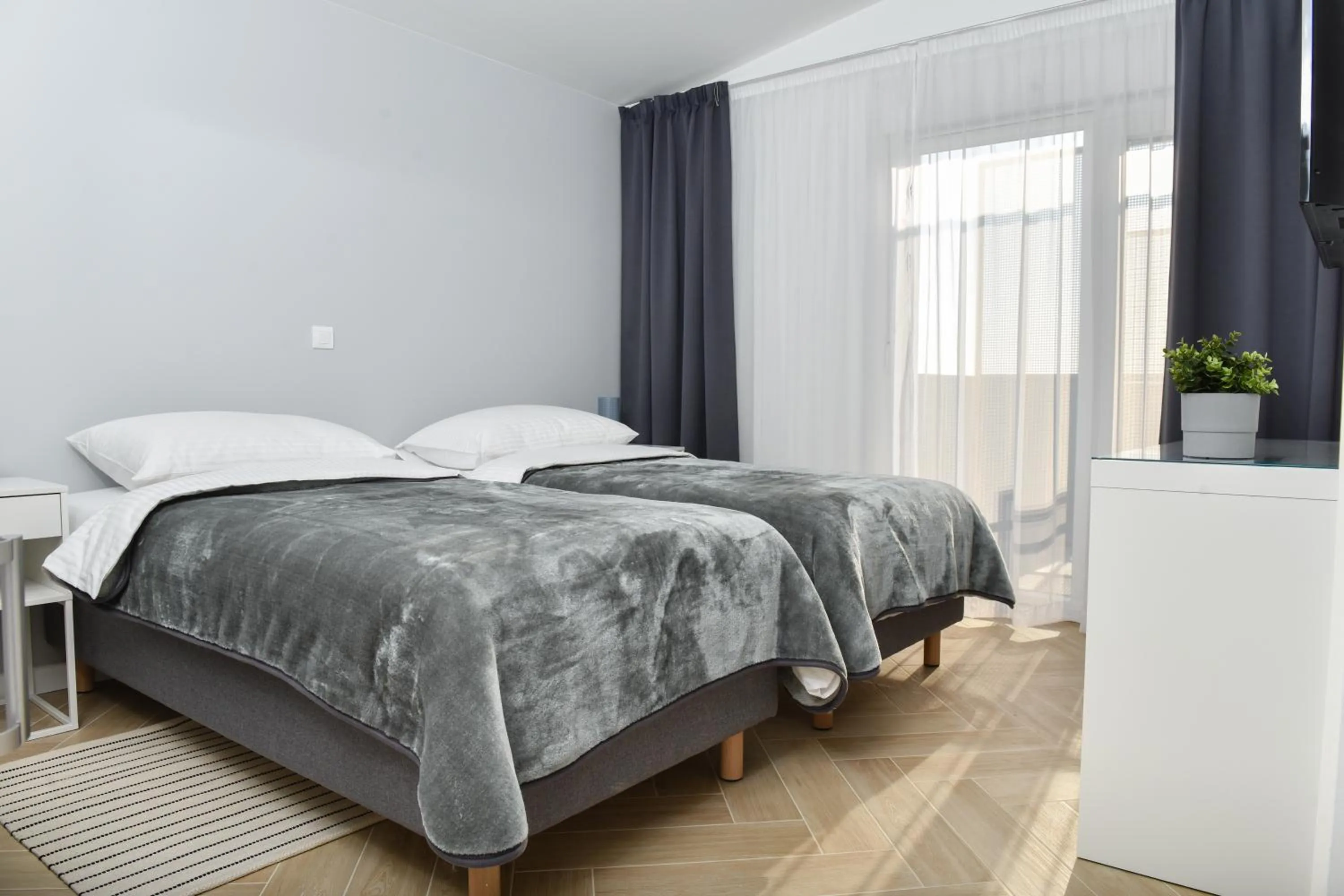 Bed in Rooms at Zajčeva 34