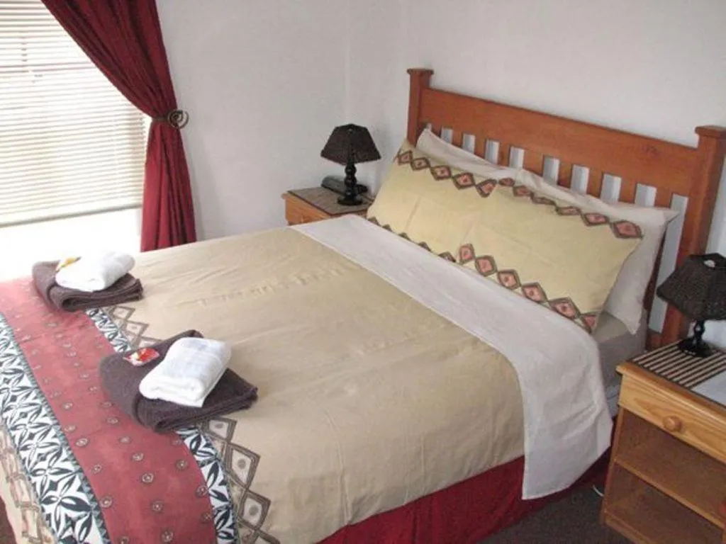 Bed in Magnolia Place Guest Houses