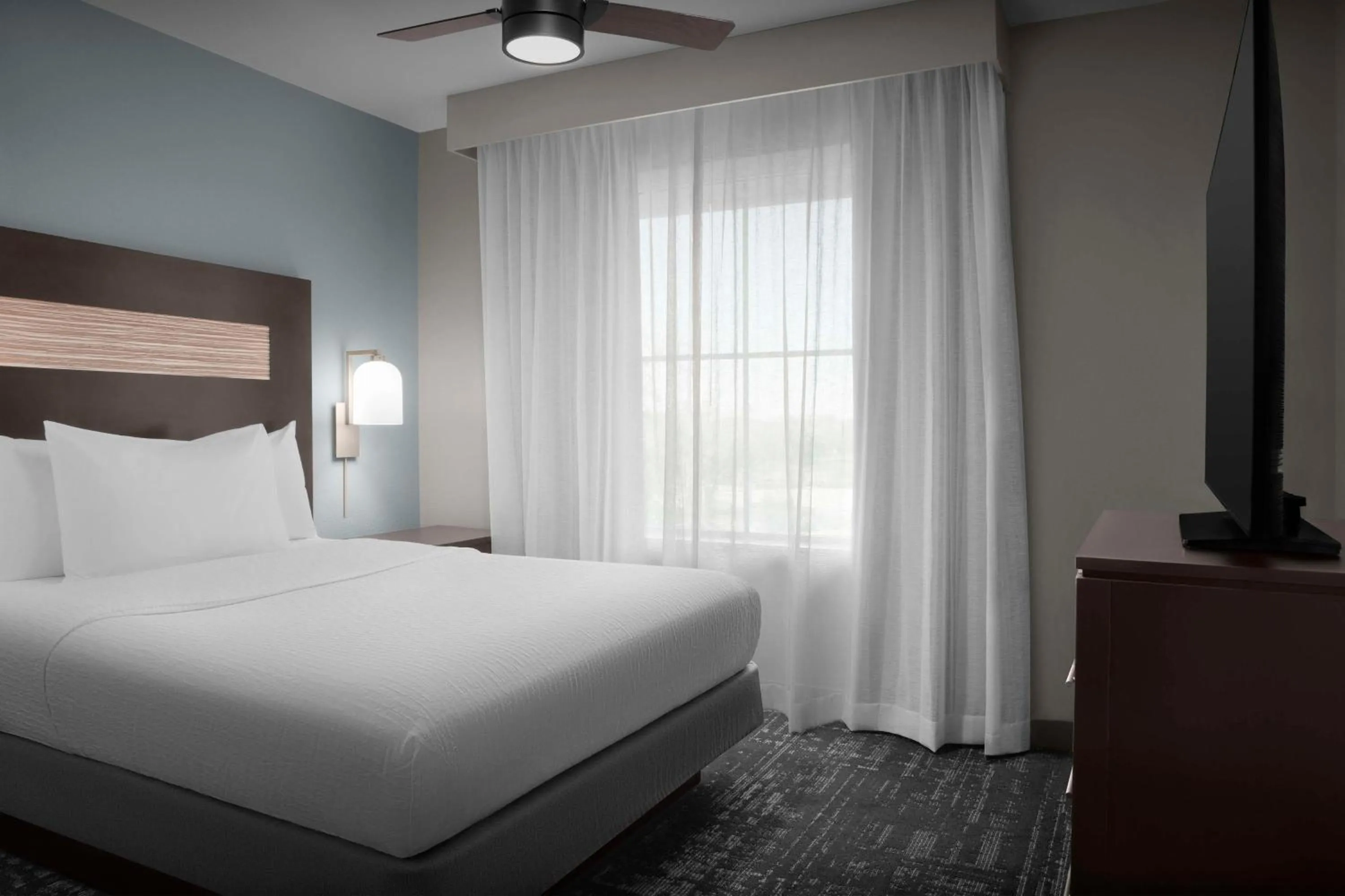 Bed in Homewood Suites by Hilton Orlando Airport