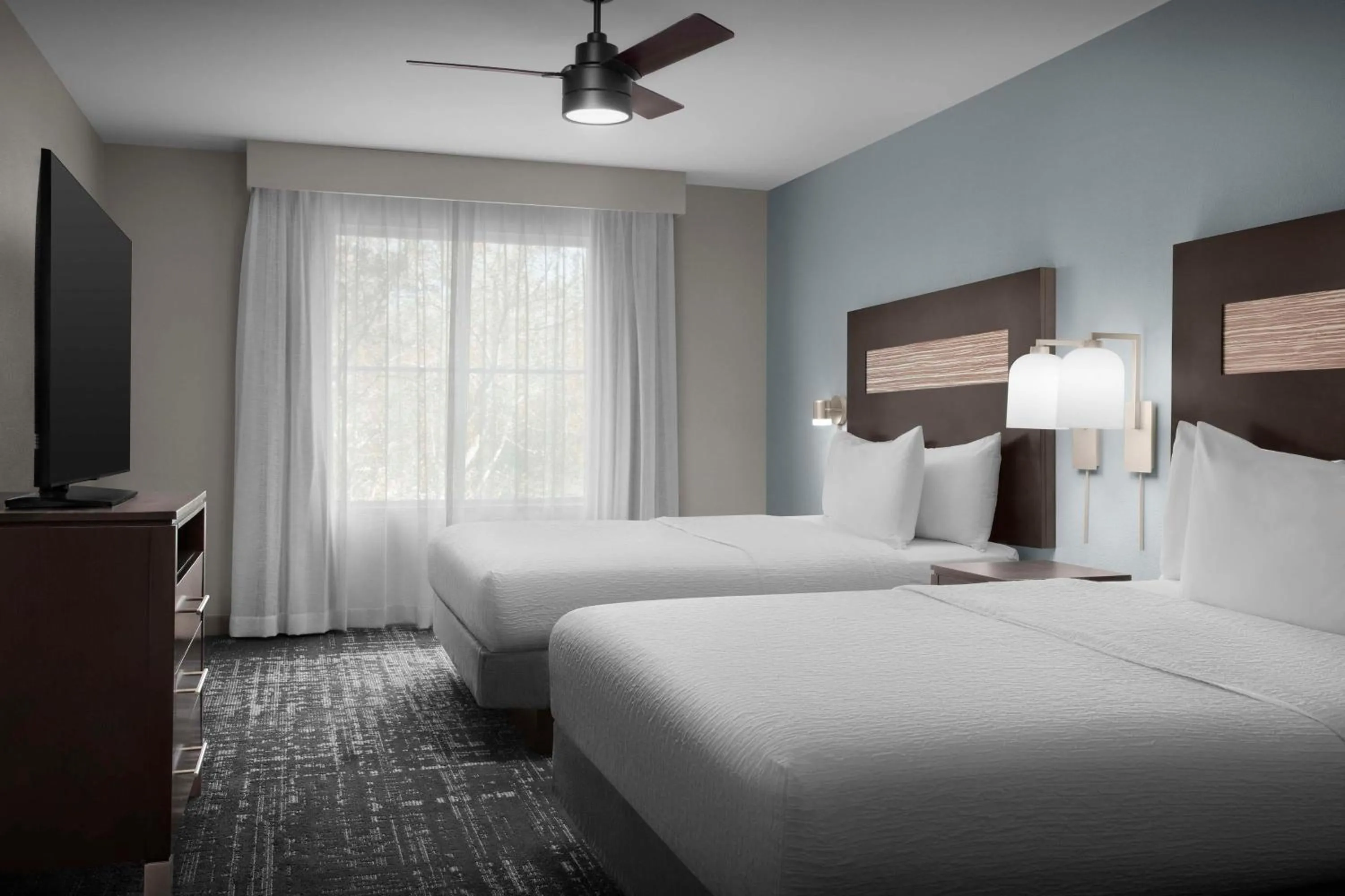 Bed in Homewood Suites by Hilton Orlando Airport