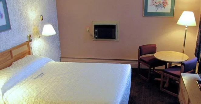 Bed in Blue Bird Hotel