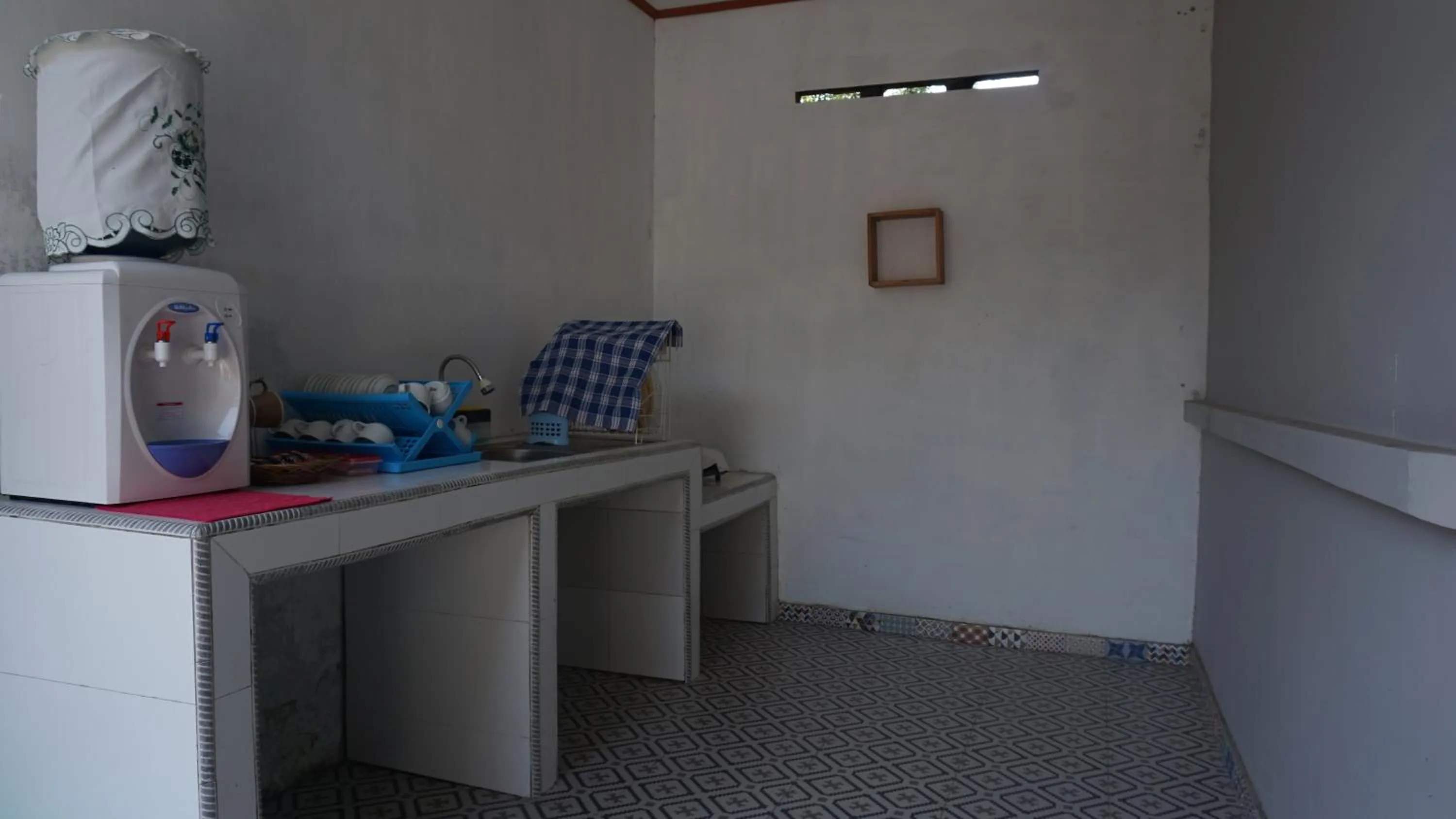 Kitchen or kitchenette in Genthong Homestay