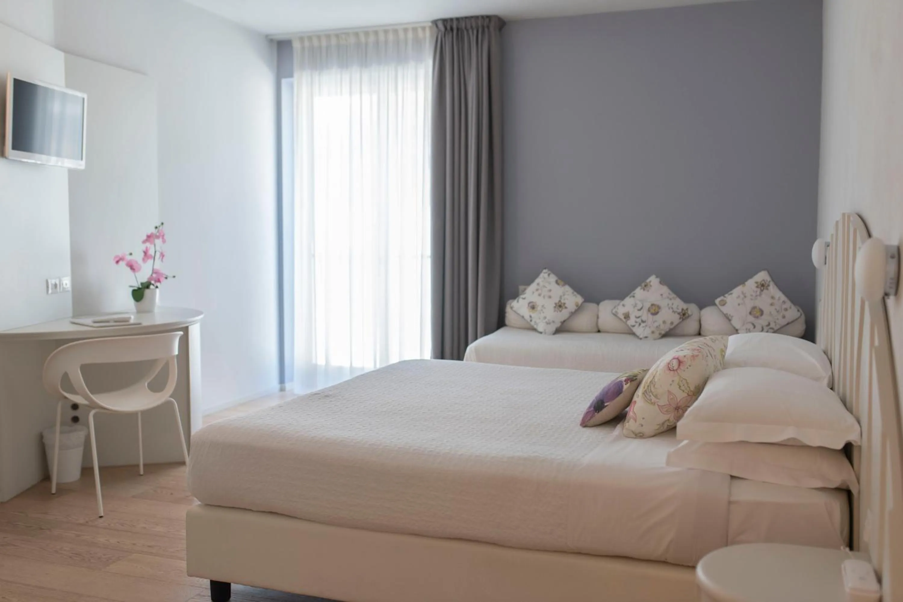 Bed in Aromi Piccolo Hotel