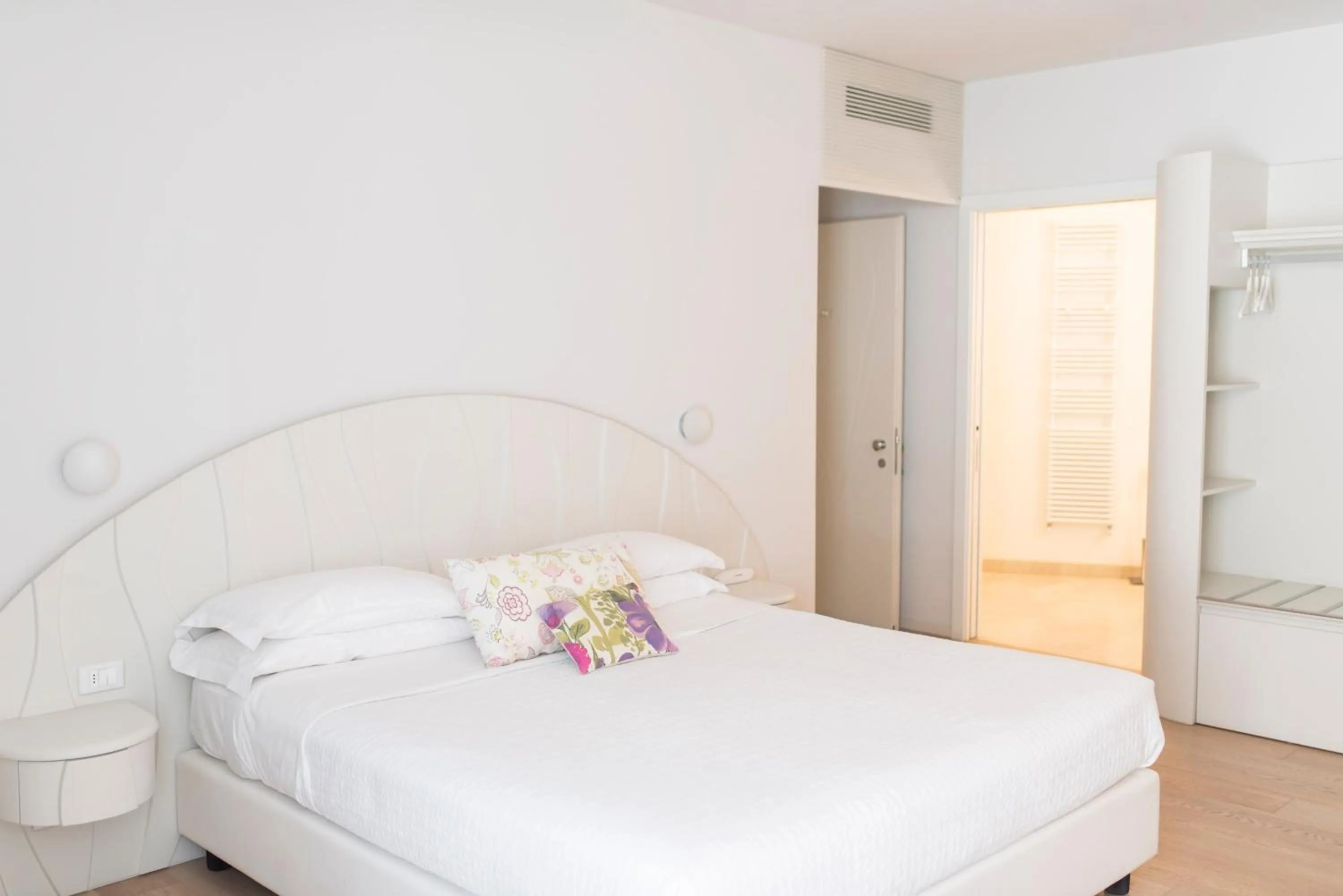 Bed in Aromi Piccolo Hotel