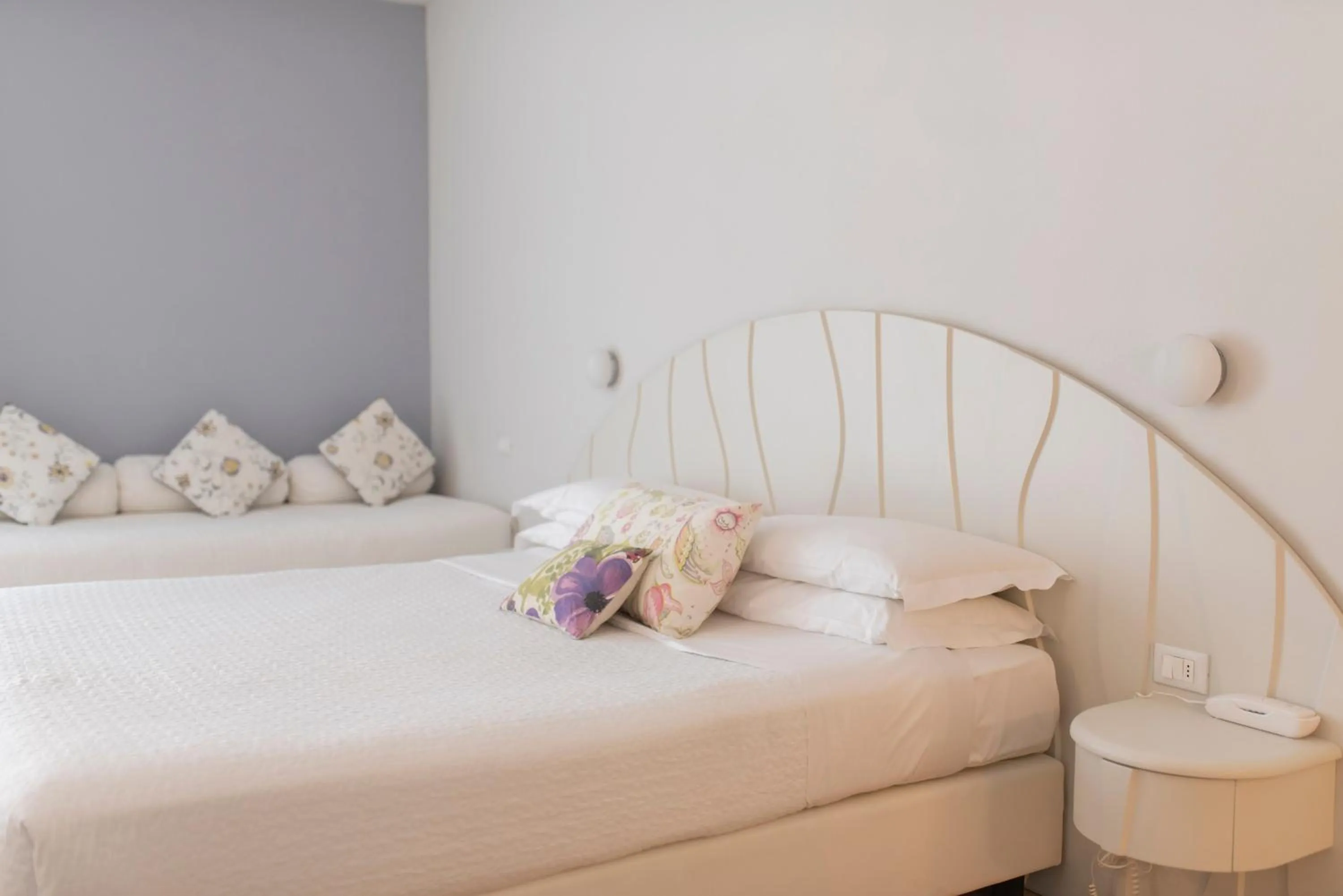 Bed in Aromi Piccolo Hotel