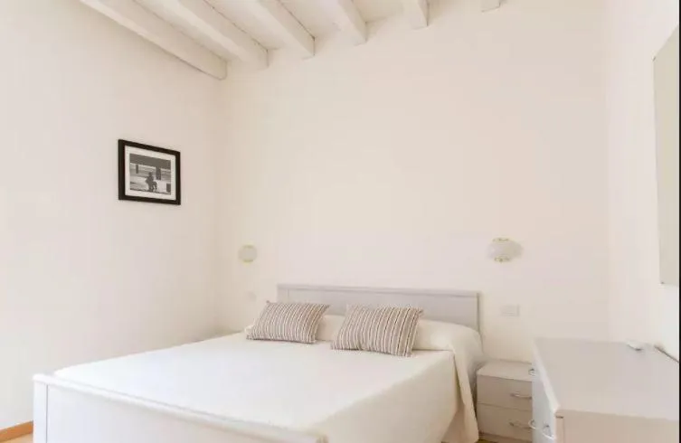 Bed in Aromi Piccolo Hotel