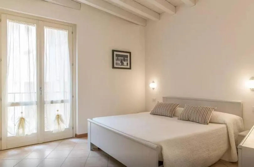 Bed in Aromi Piccolo Hotel