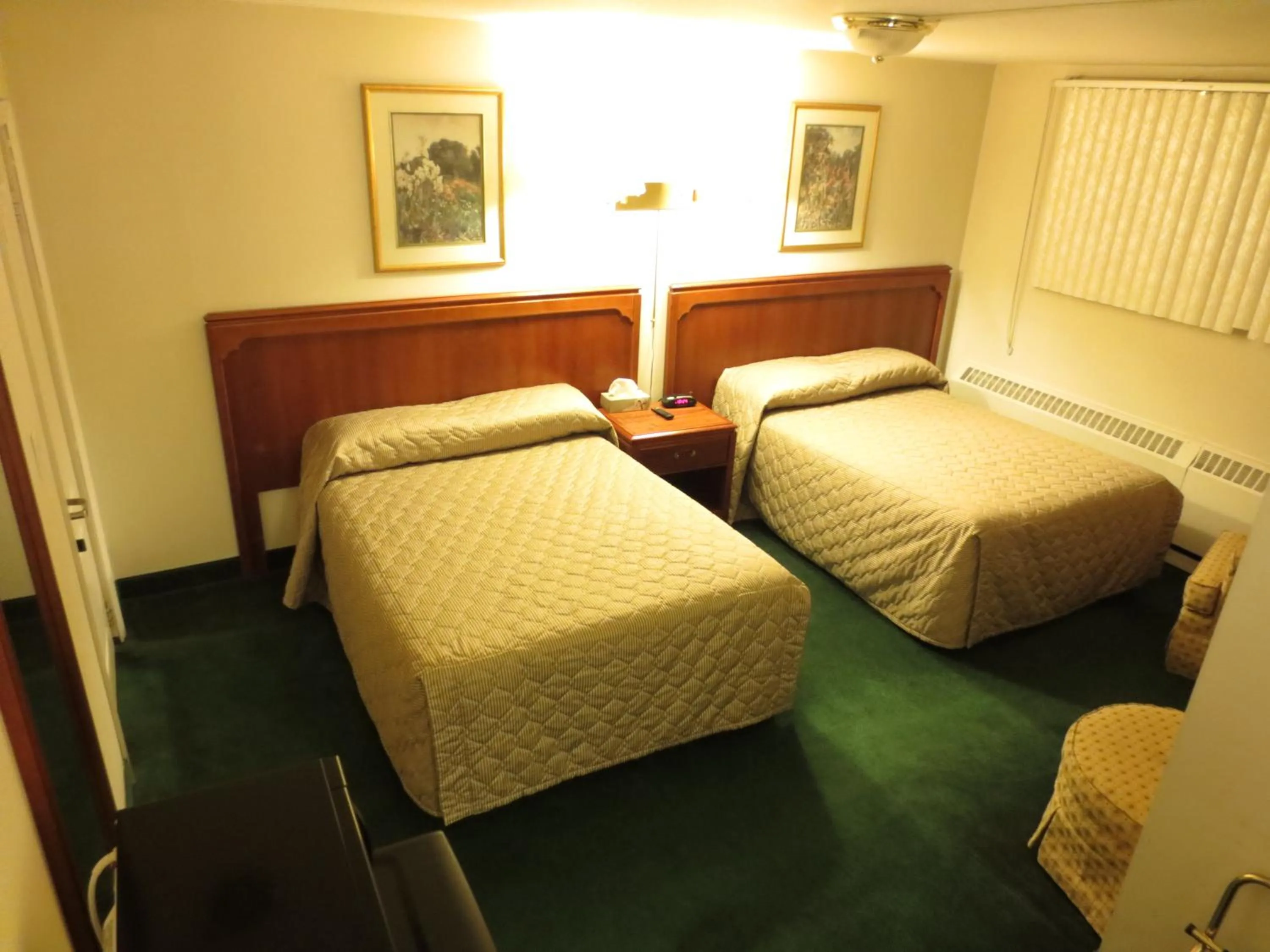 Bed in Canadiana Motel