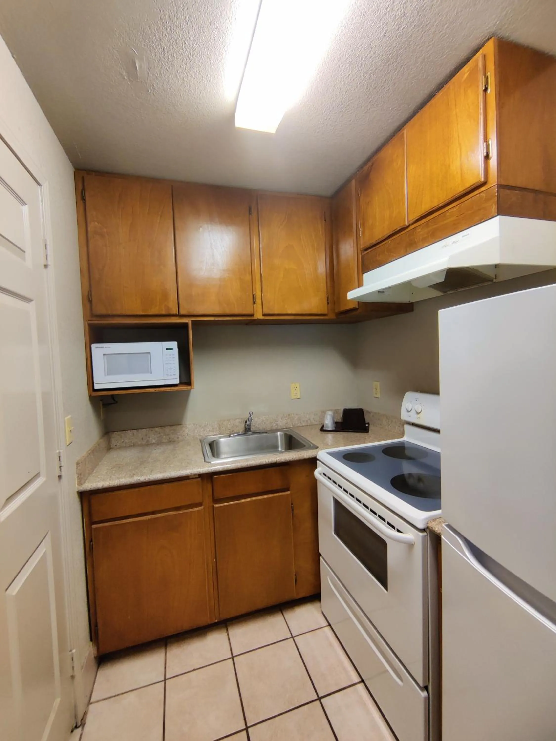 Kitchen or kitchenette in Regency Inn & Suites By Capital O Houston IAH Airport