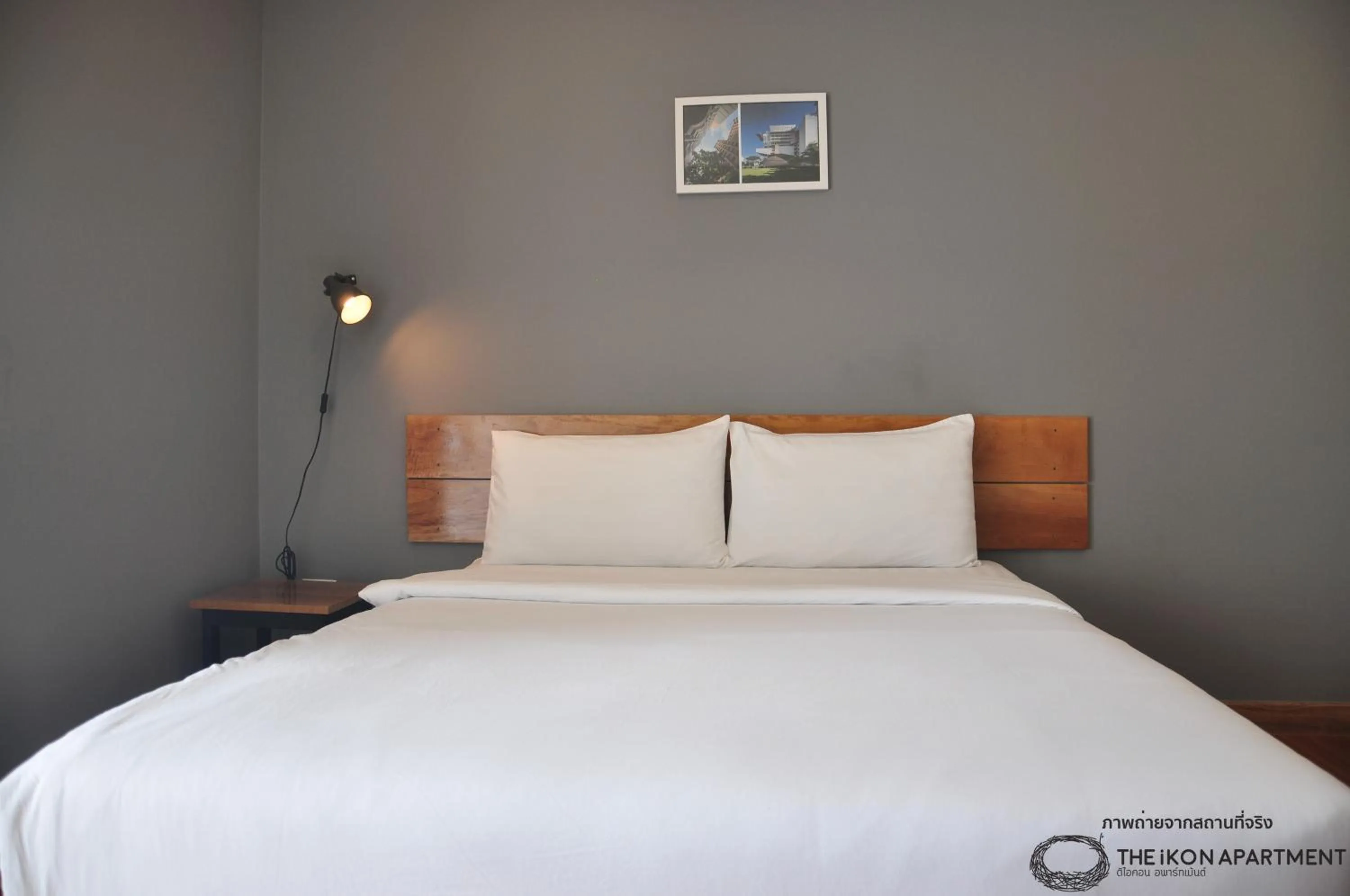 Bed in The iKon Apartment