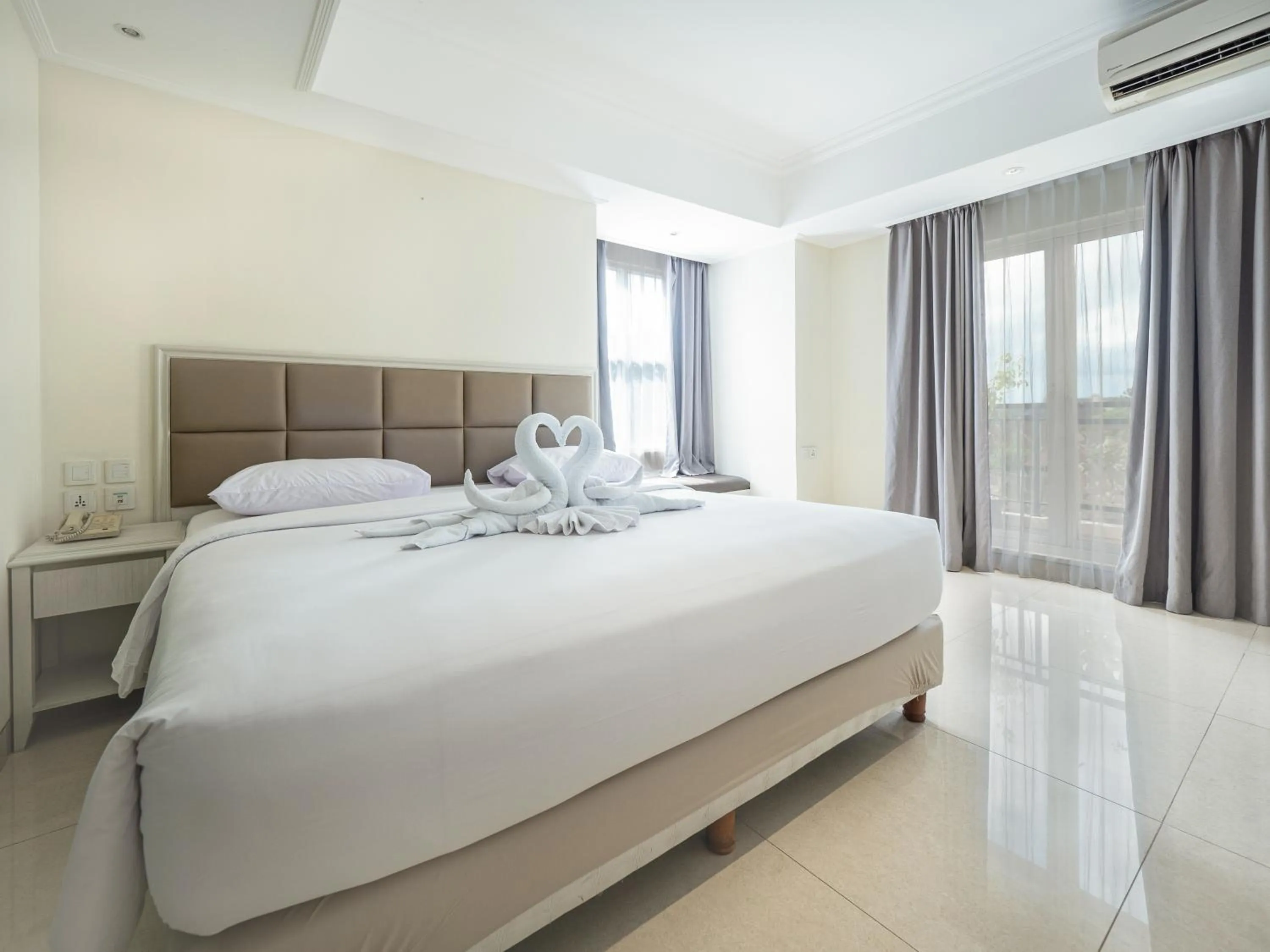 Bed in Alron Hotel Kuta Powered by Archipelago