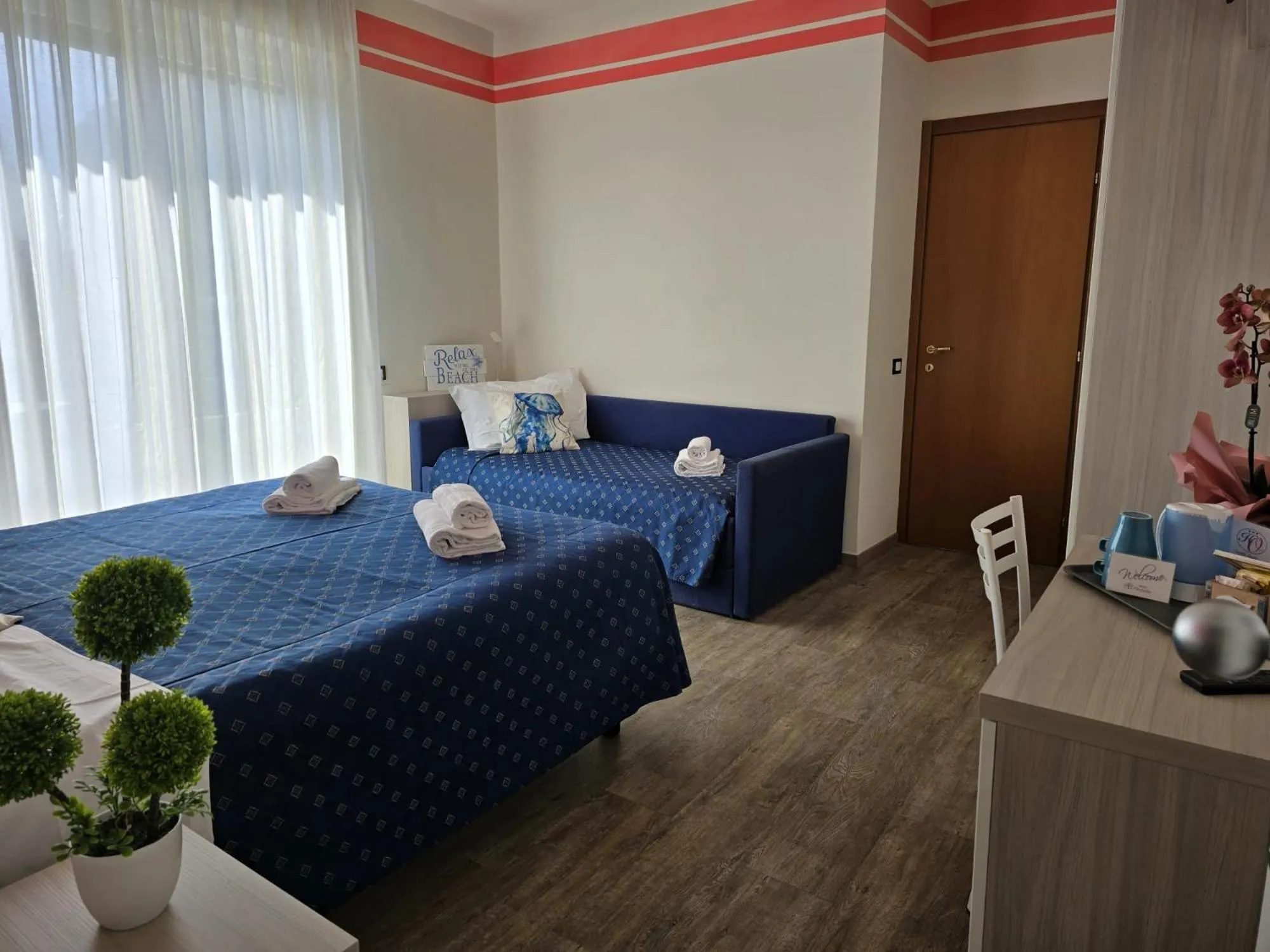 Bed in Hotel Orchidea