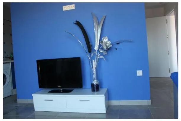 Communal lounge/ TV room in Apartamentos Turísticos La Boutique del Mar