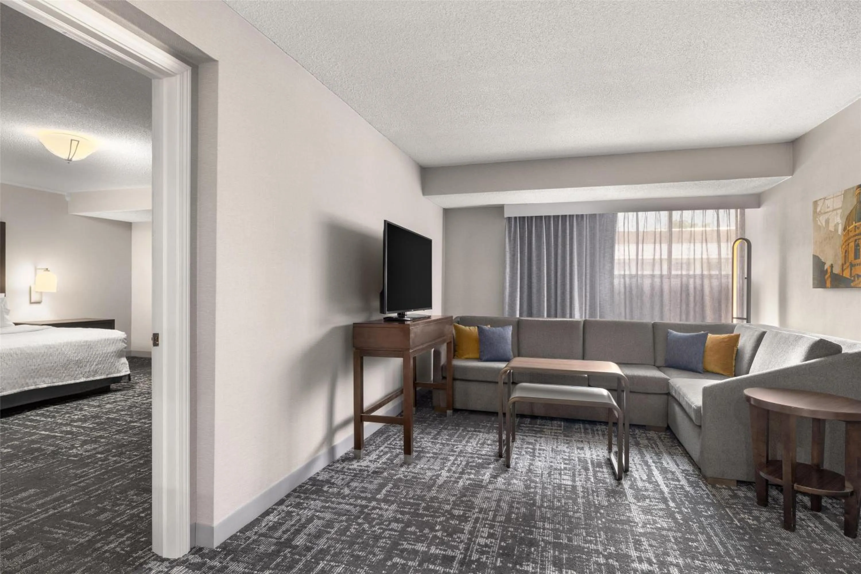 Living room, Bed in Homewood Suites by Hilton Indianapolis Carmel