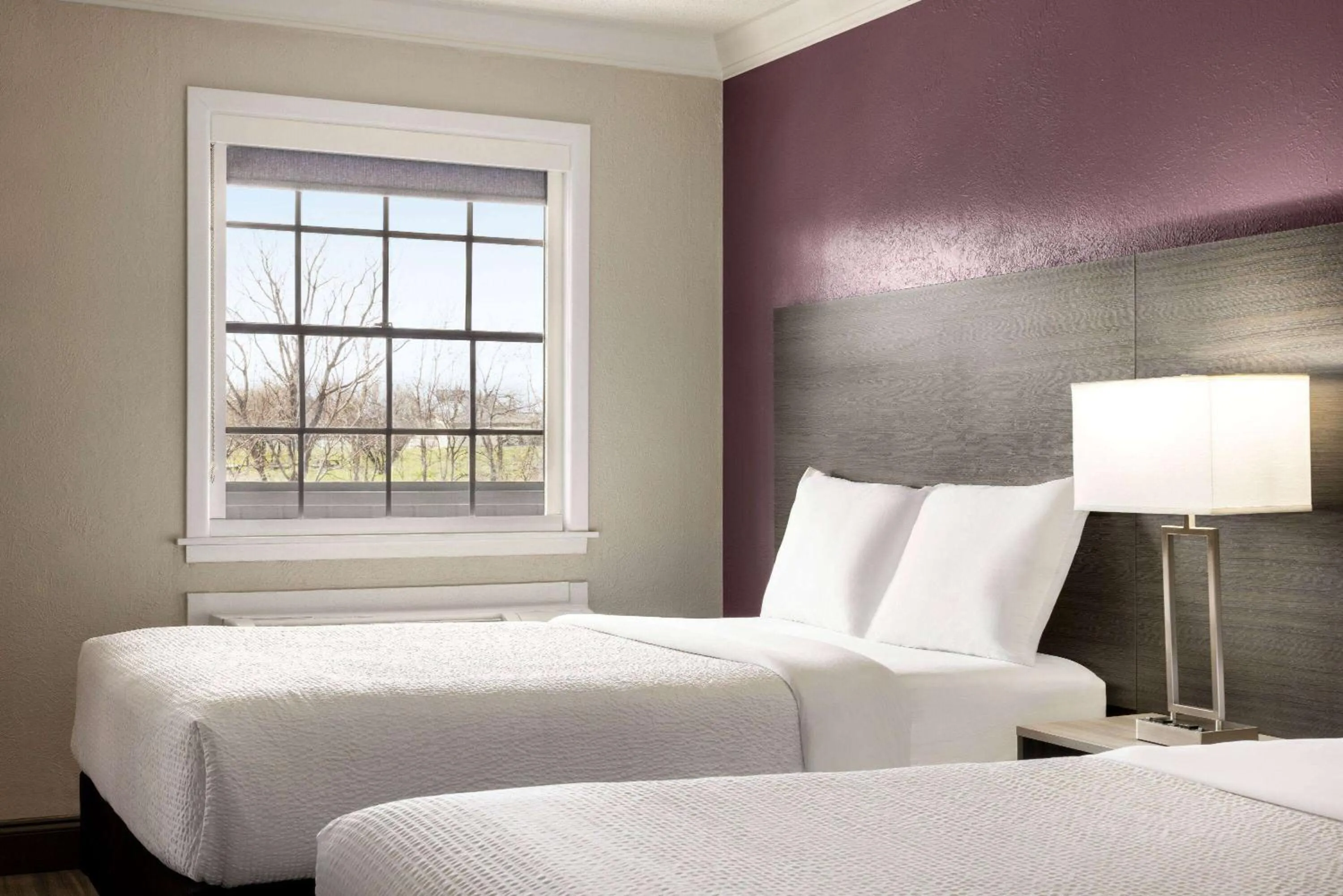 Bed in La Quinta Inn by Wyndham San Antonio Lackland