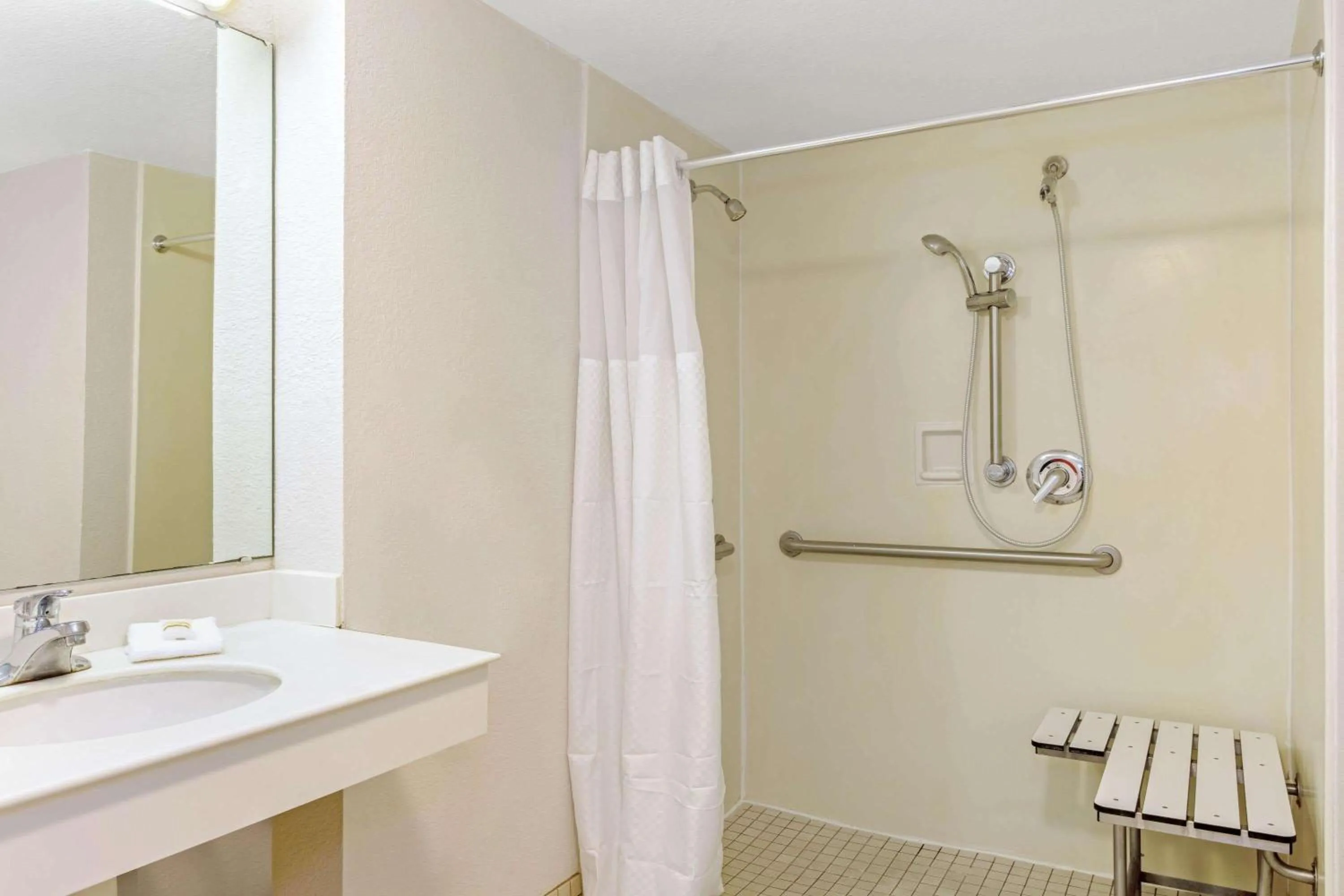 Shower in La Quinta Inn by Wyndham Orlando Airport West