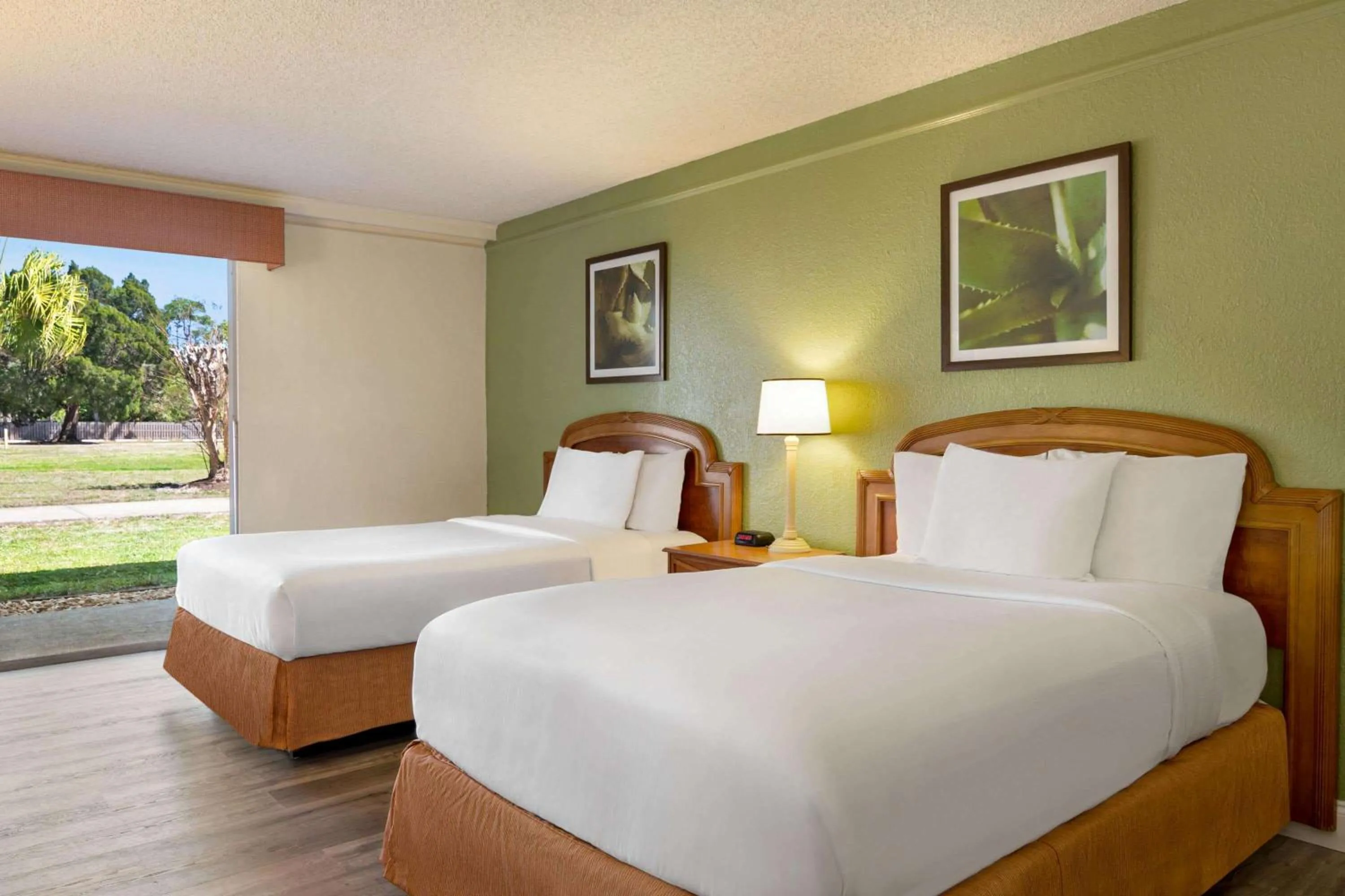 Photo of the whole room, Bed in Baymont by Wyndham Intl Speedway I-95 Daytona Beach