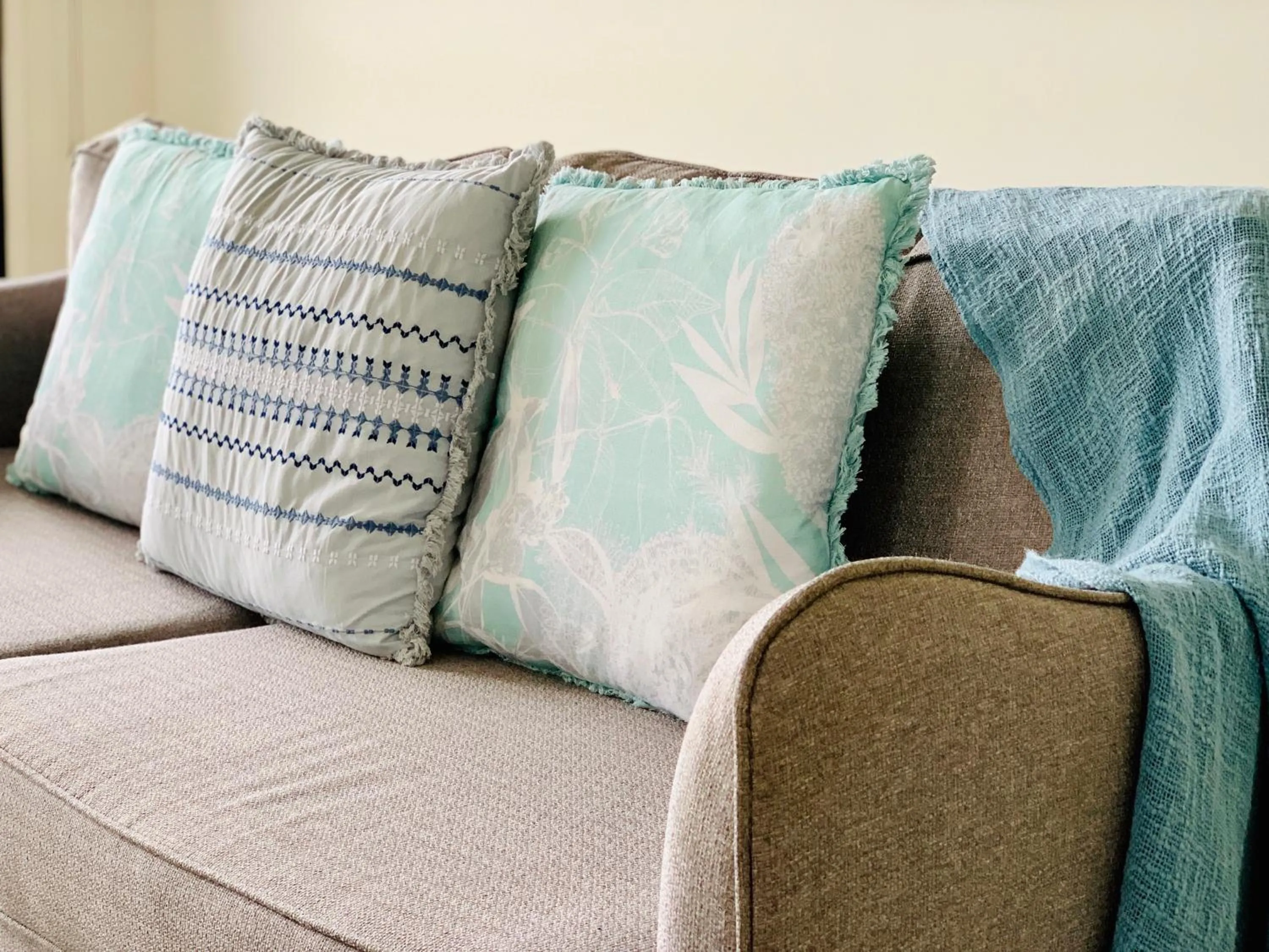 Living room in DAYDREAMING Airlie Beach, Water views & only 200m to boardwalk.