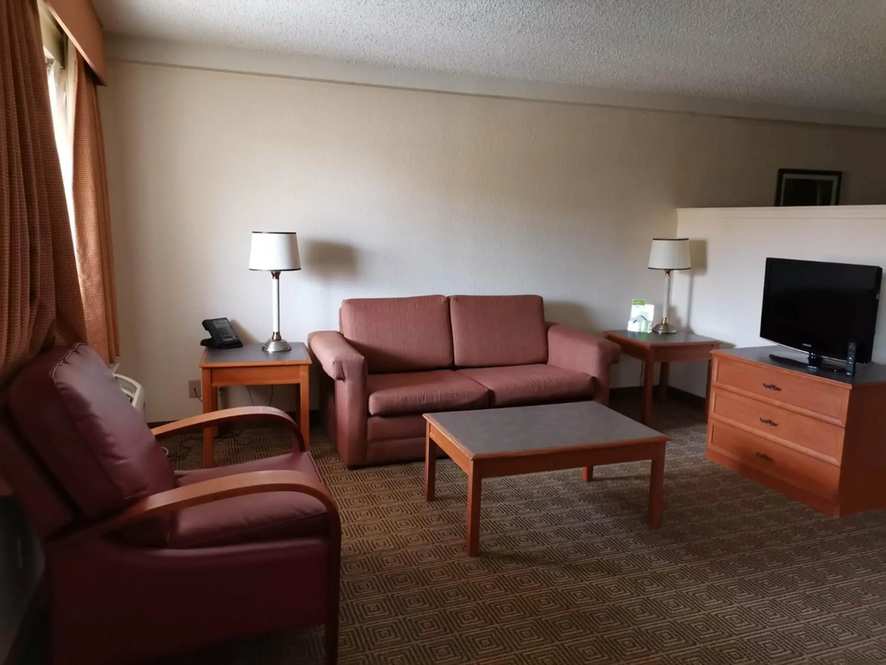 Living room in Super 8 by Wyndham San Antonio Near SeaWorld Ingram Park Living room in Super 8 by Wyndham San Antonio Near SeaWorld Ingram Park