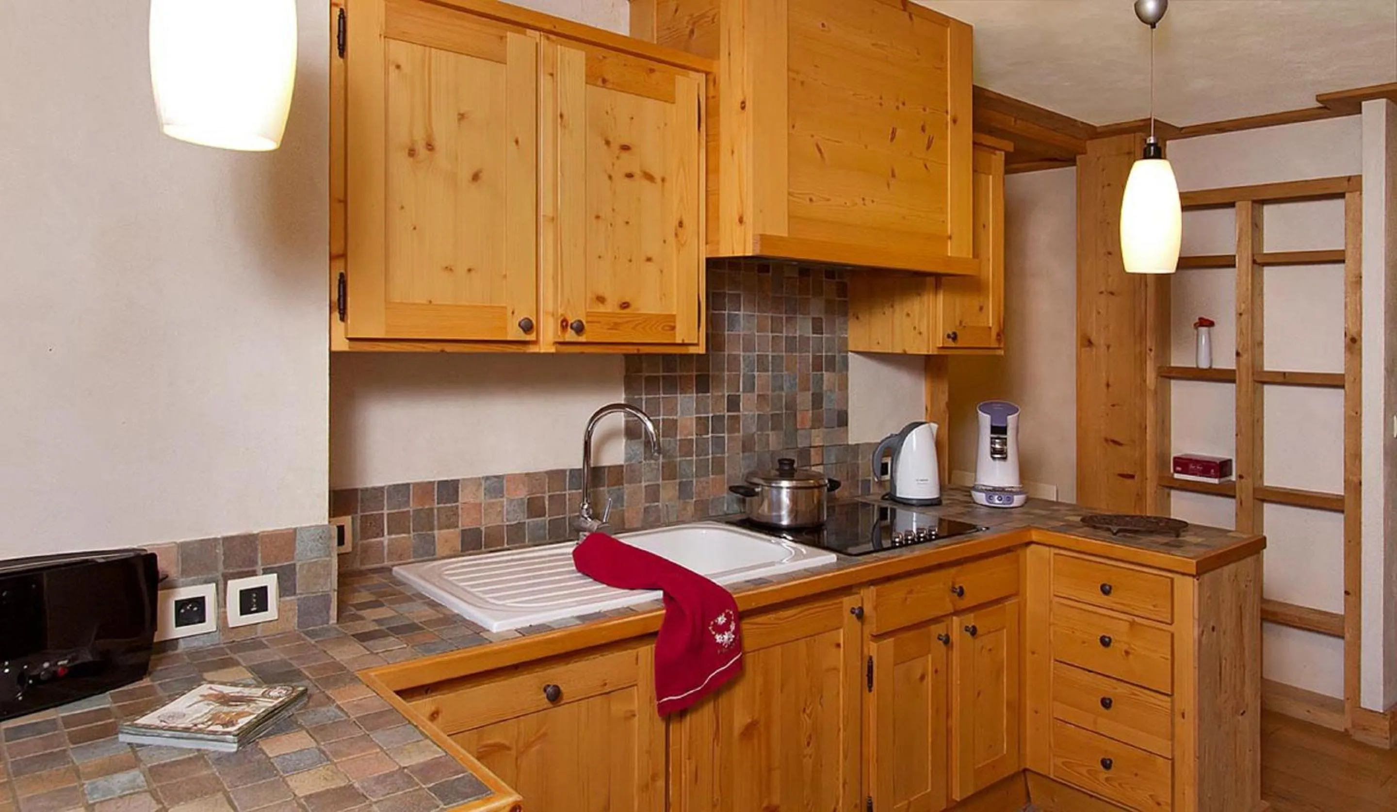 Kitchen or kitchenette in Vacancéole - Résidence Cortina
