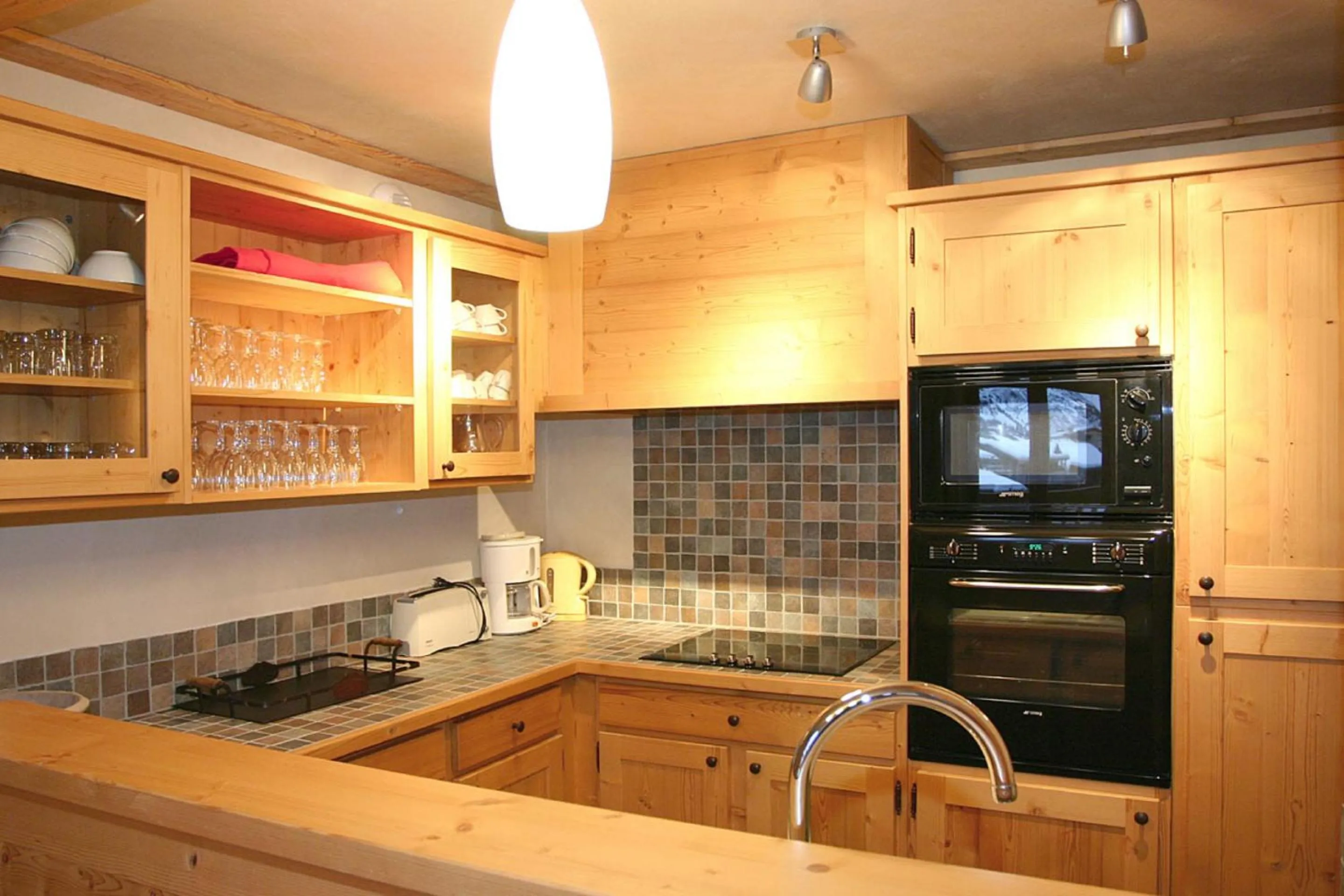 Kitchen or kitchenette in Vacancéole - Résidence Cortina