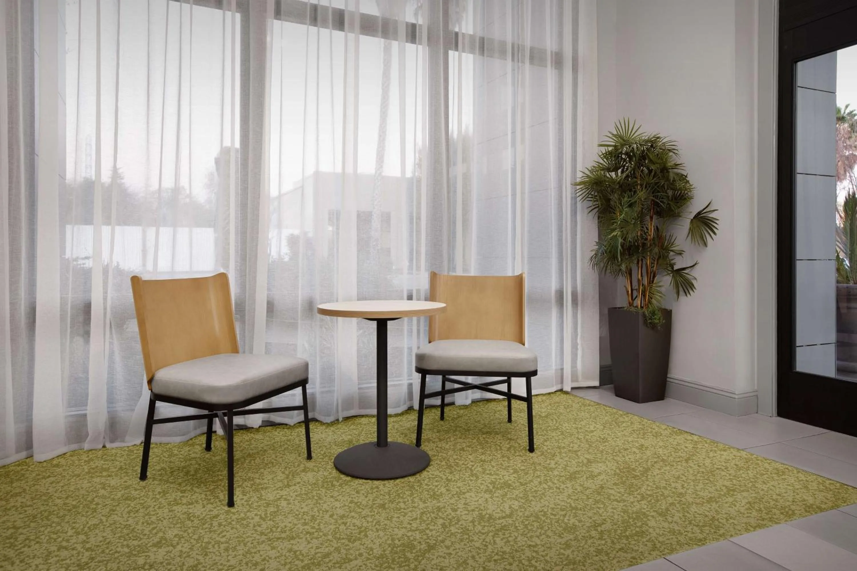 Lobby or reception in La Quinta by Wyndham San Jose Airport