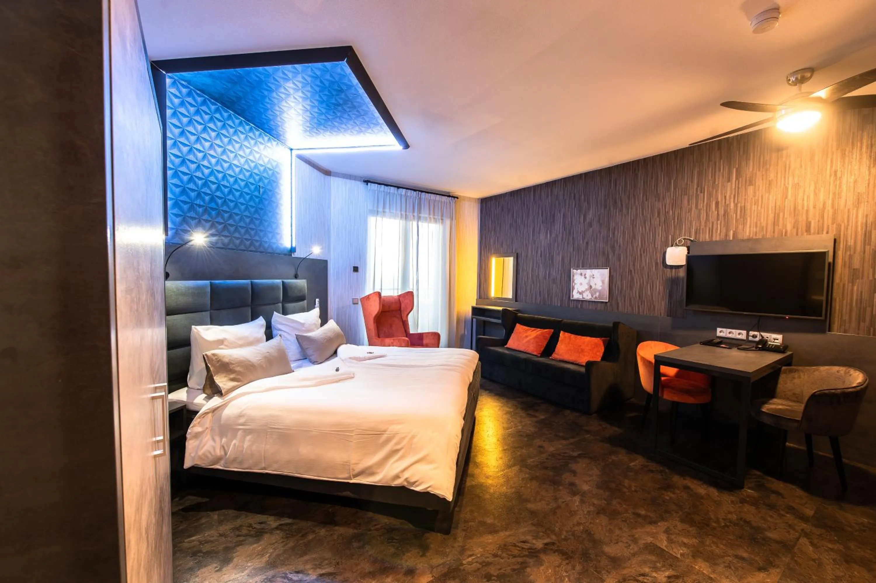 Seating area, Bed in GS Hotel