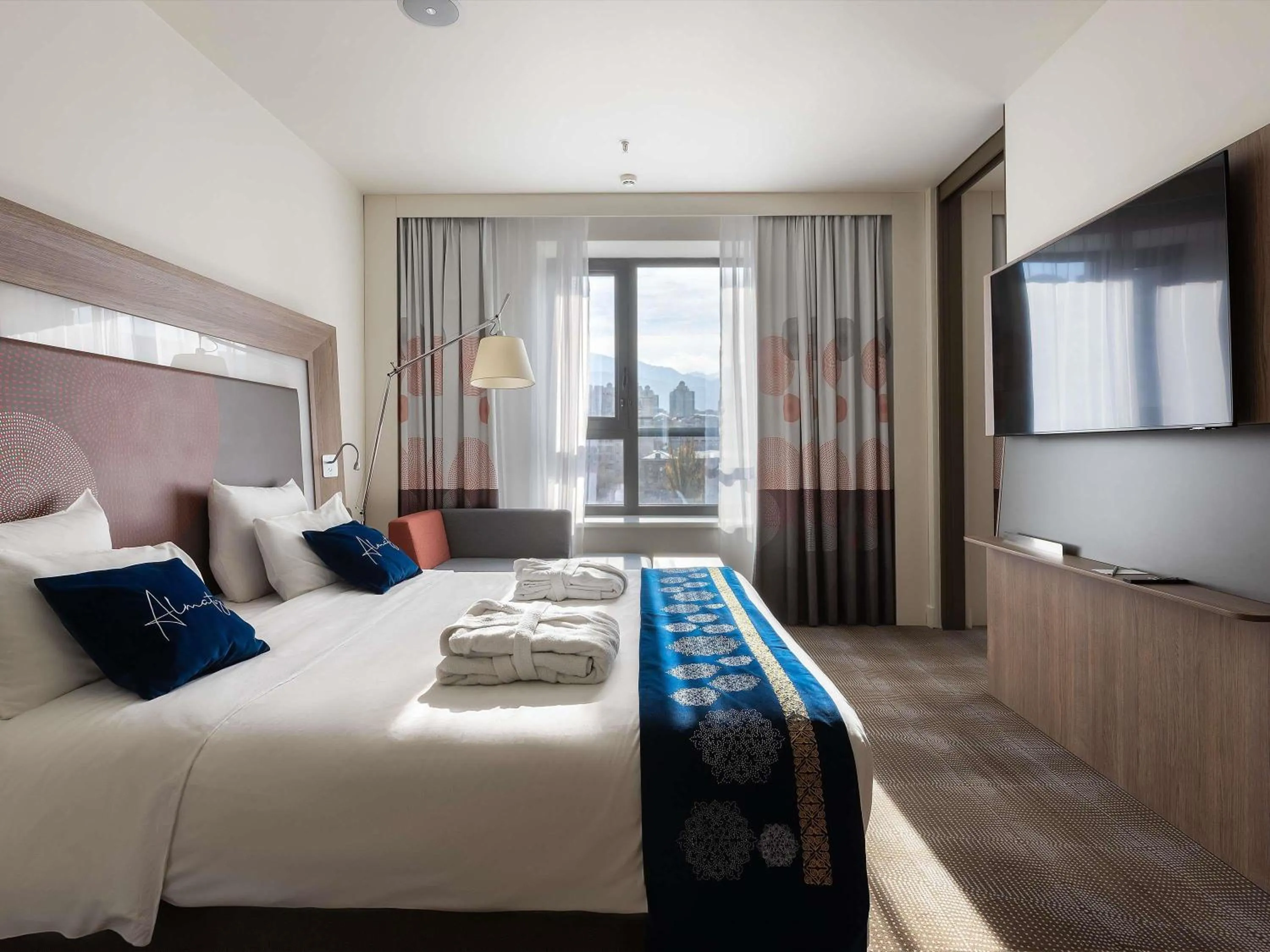 Property building, Bed in Novotel Almaty City Center