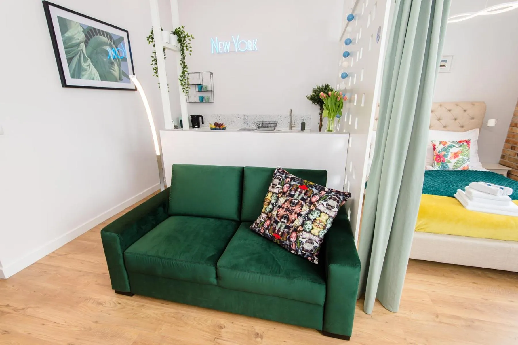 Living room, Bed in Bliss Apartments