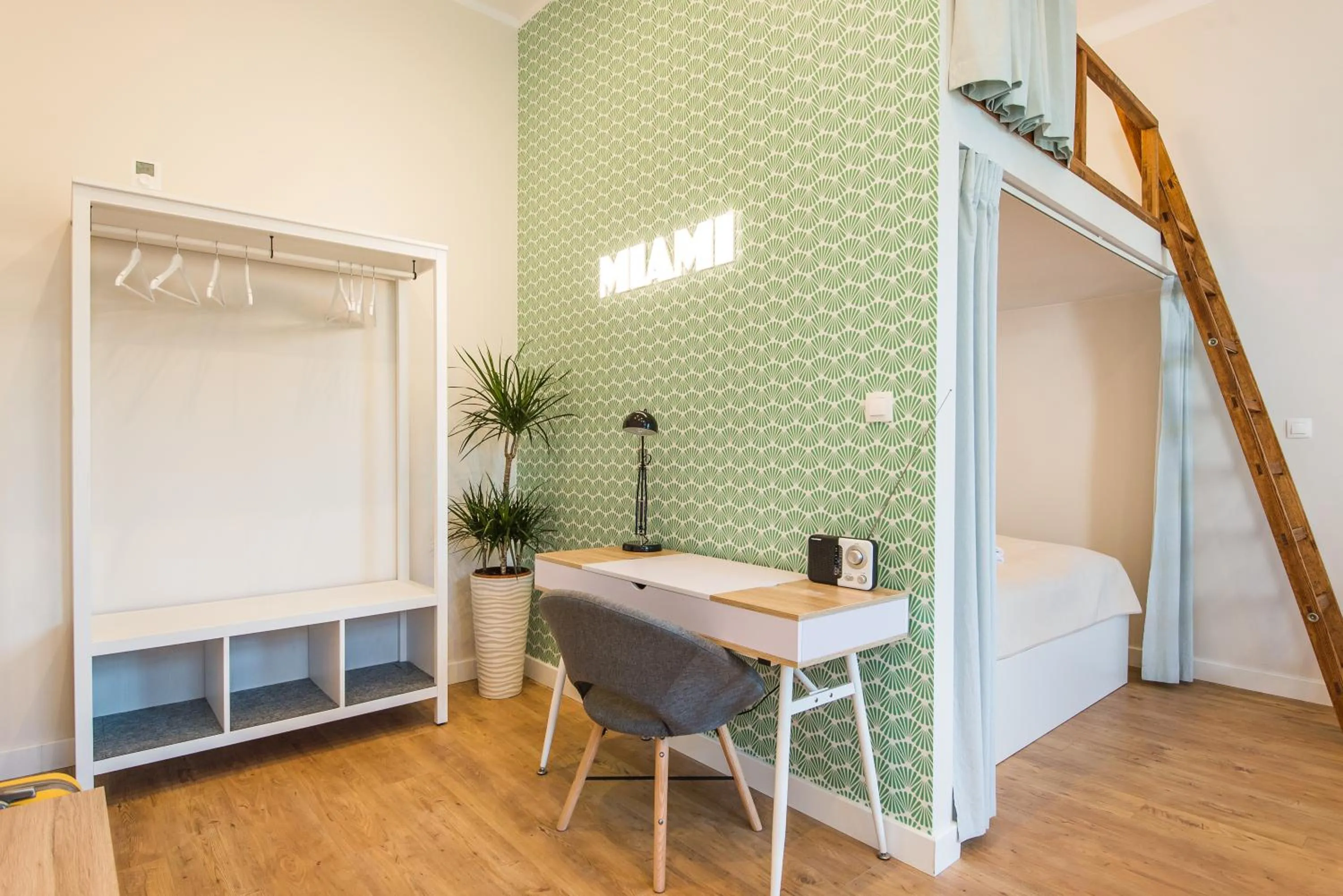 Living room, Bed in Bliss Apartments