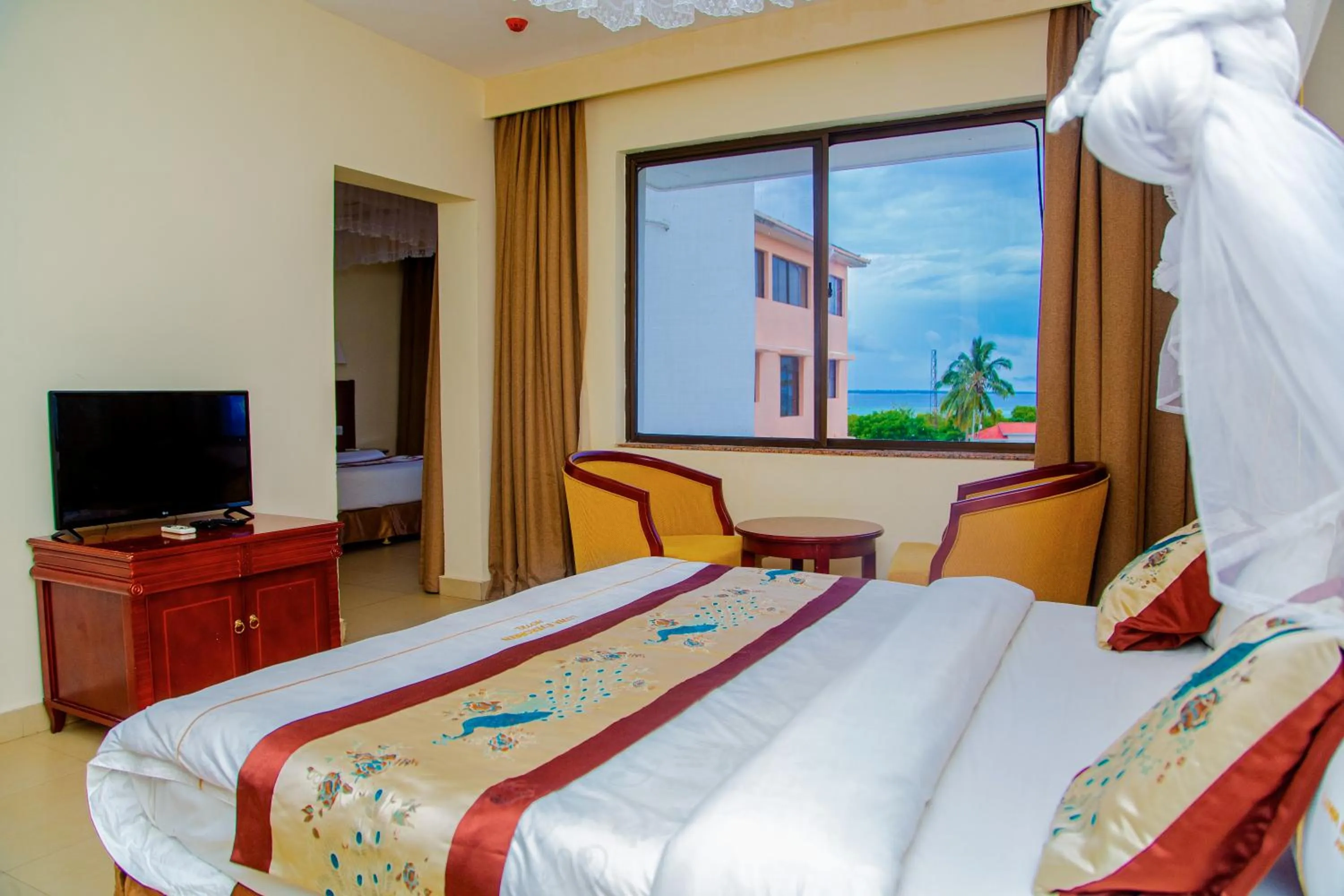 Bed in Luwa Evergreen Hotel