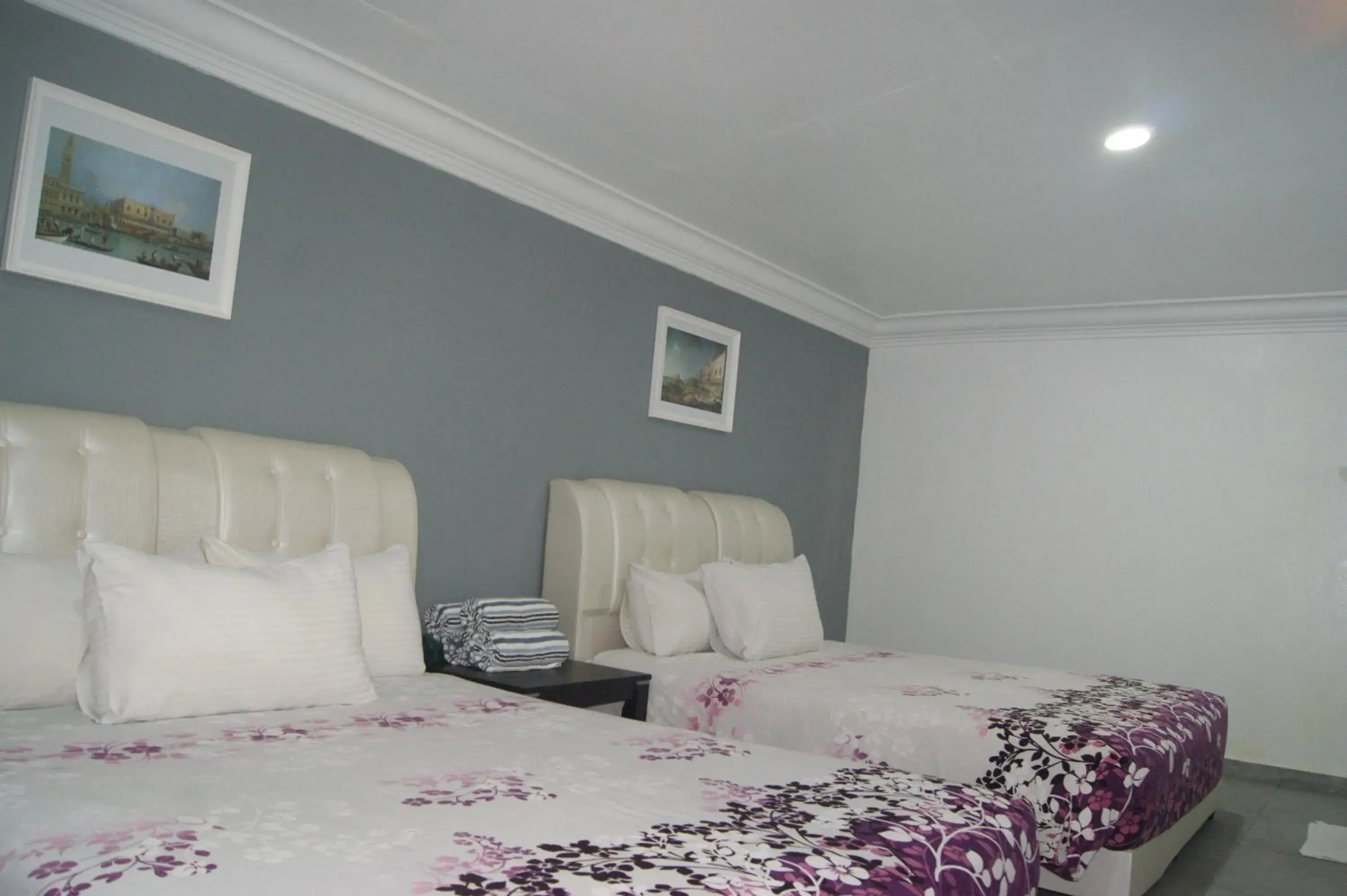 Bed in HOTEL SHAFURA 2