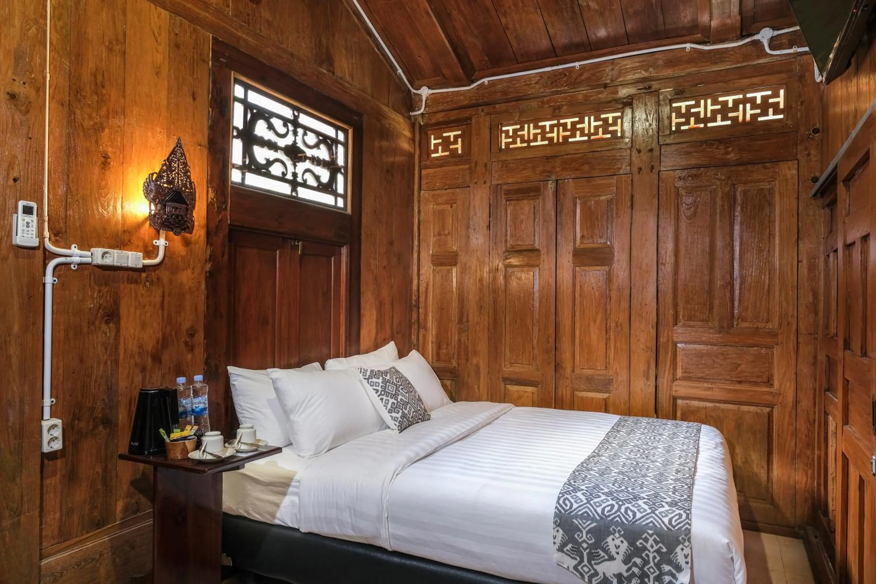 Bed in Kampoeng Joglo Boutique Hotel