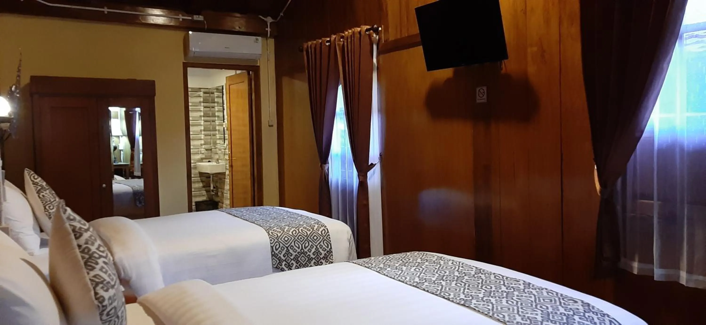 Bed in Kampoeng Joglo Boutique Hotel