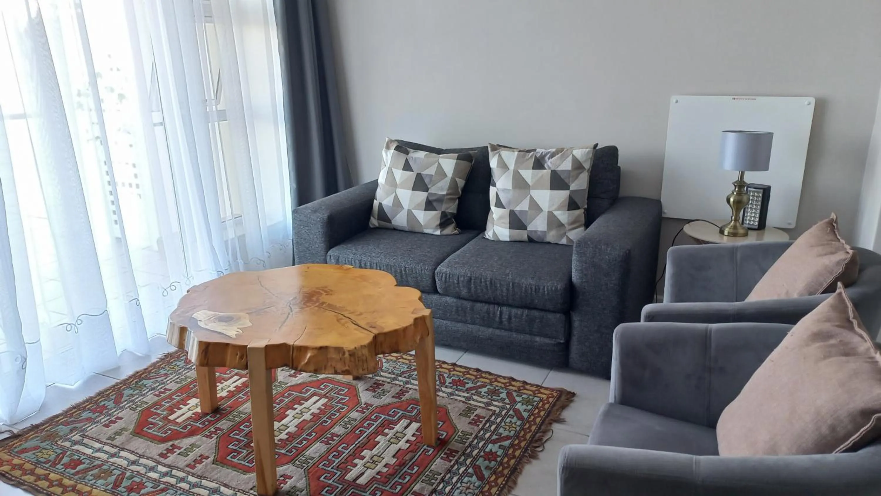 Seating area in Phoenix Lodge and Waterside Accommodation