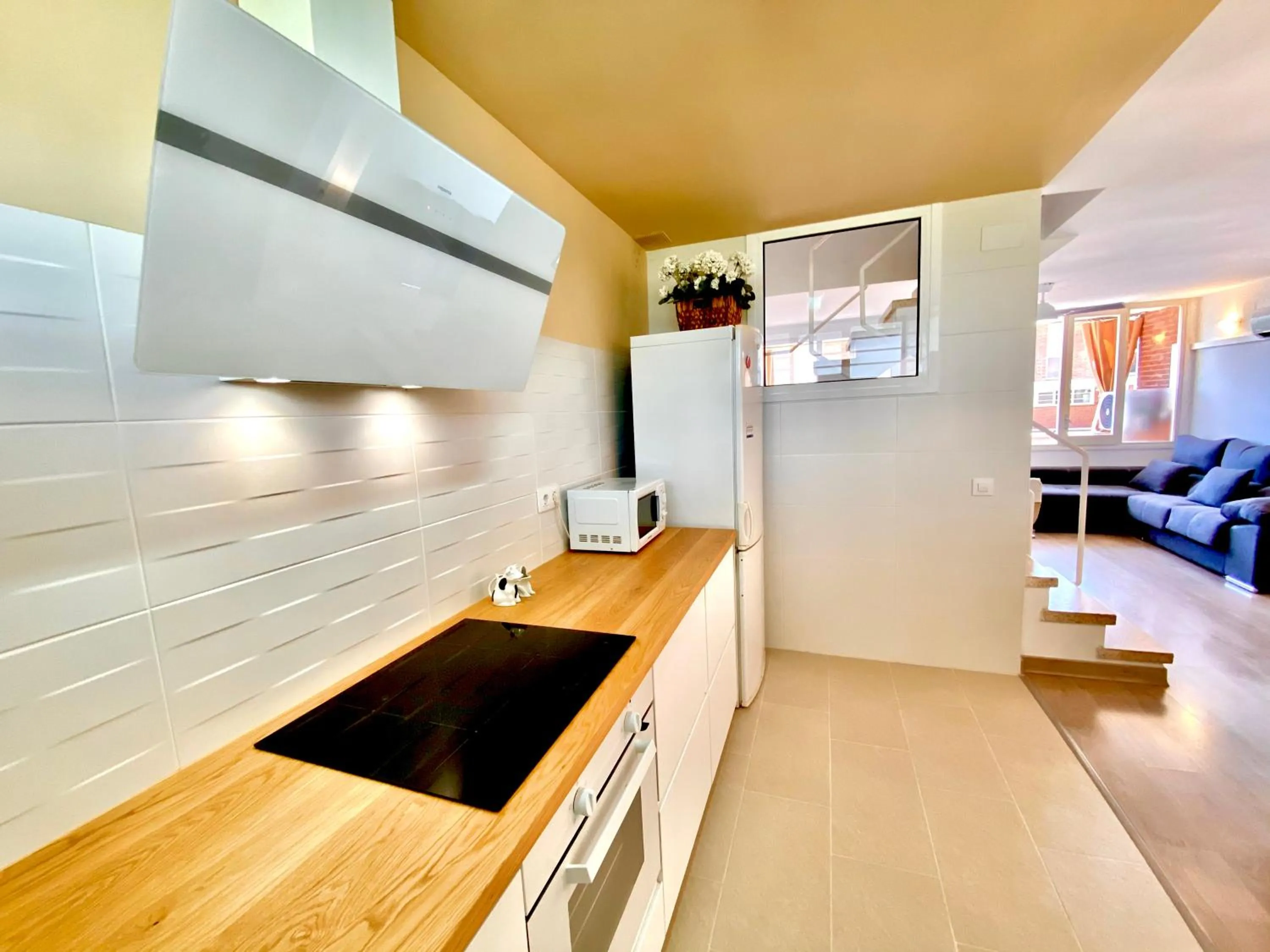 Kitchen or kitchenette in Sun pool duplex apartment by HLCLUB Agency