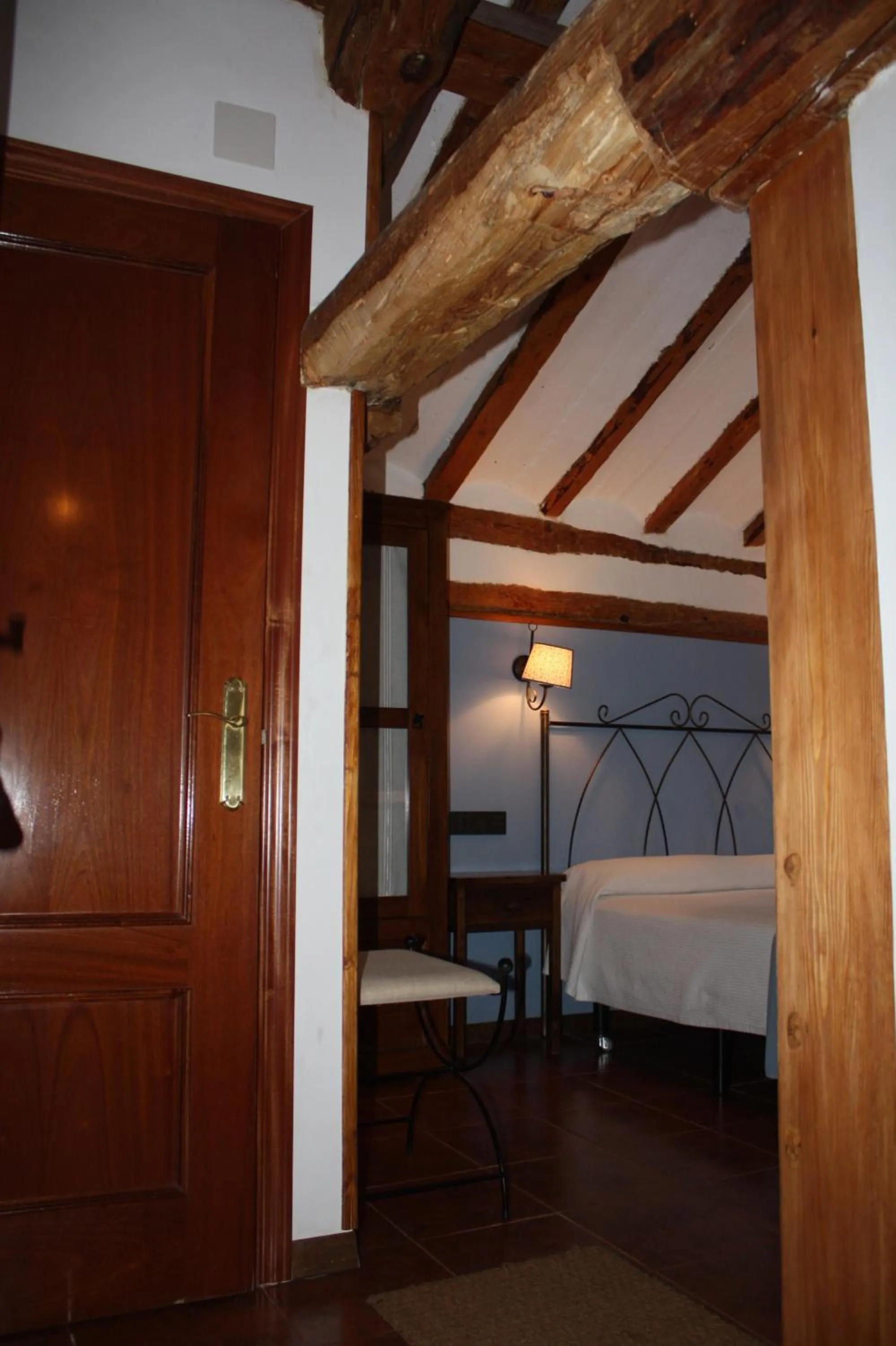 Decorative detail, Bed in Hotel Mesón del Gallo