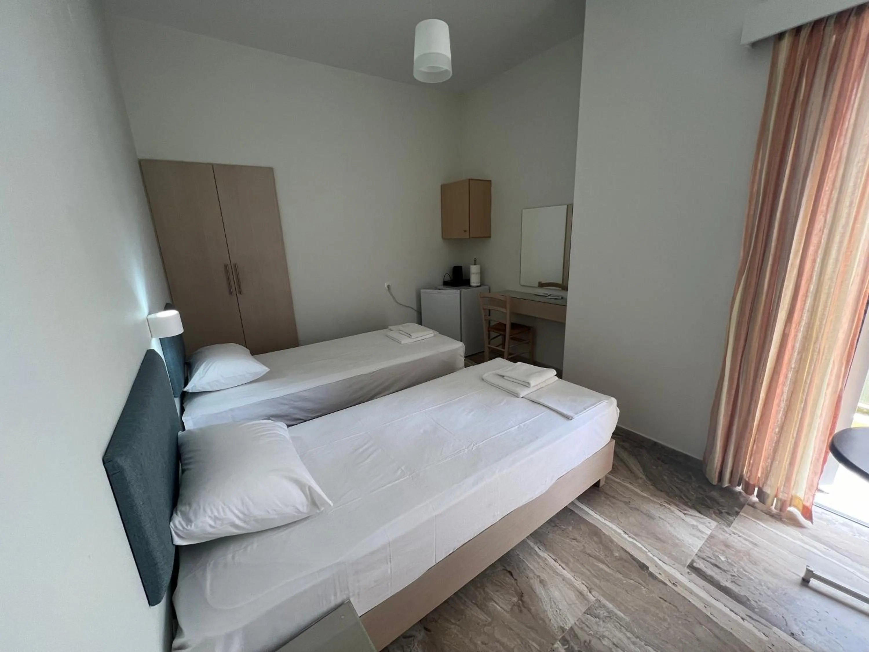 Bed in Neapolis Apartments