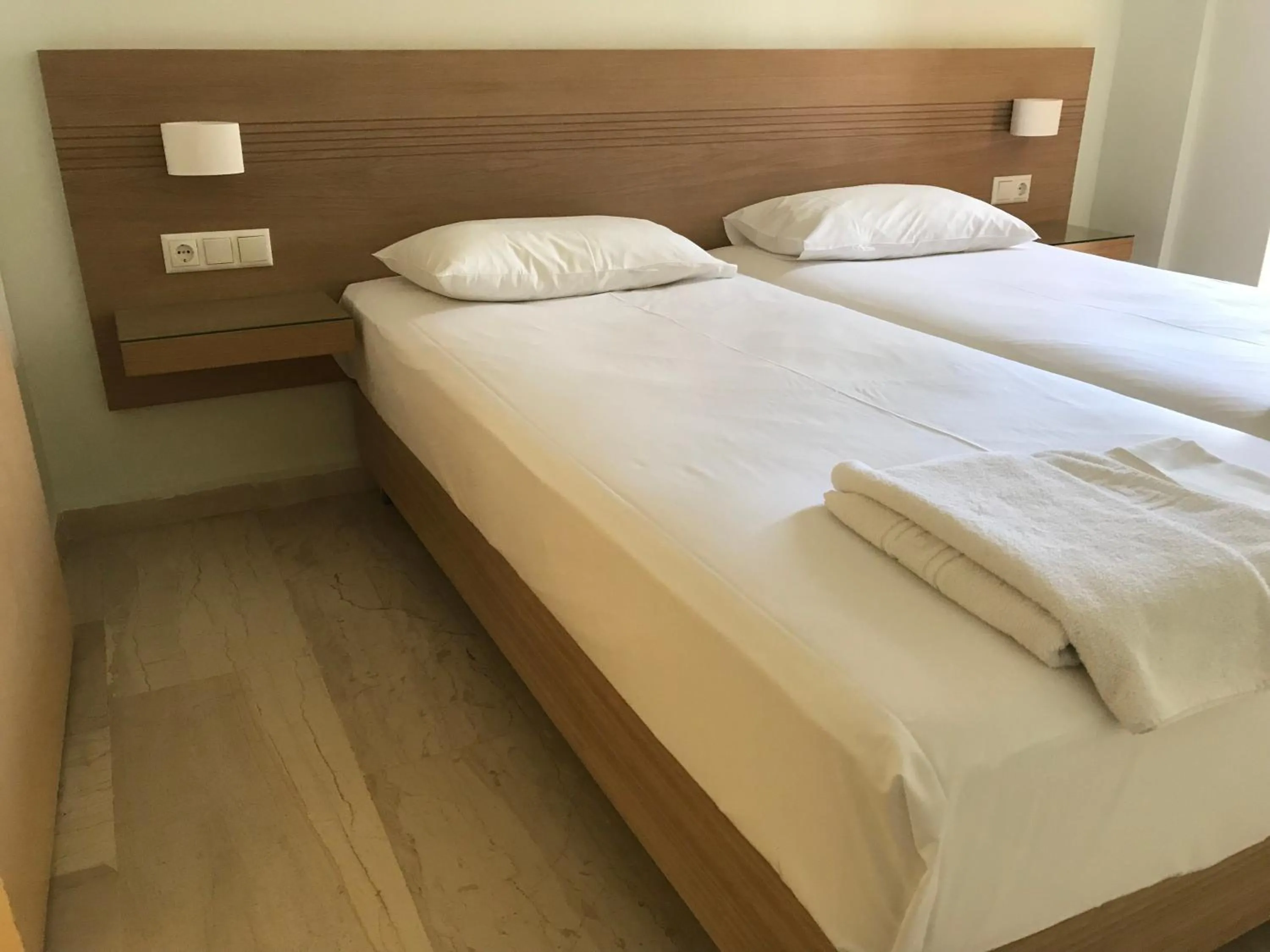 Bed in Neapolis Apartments