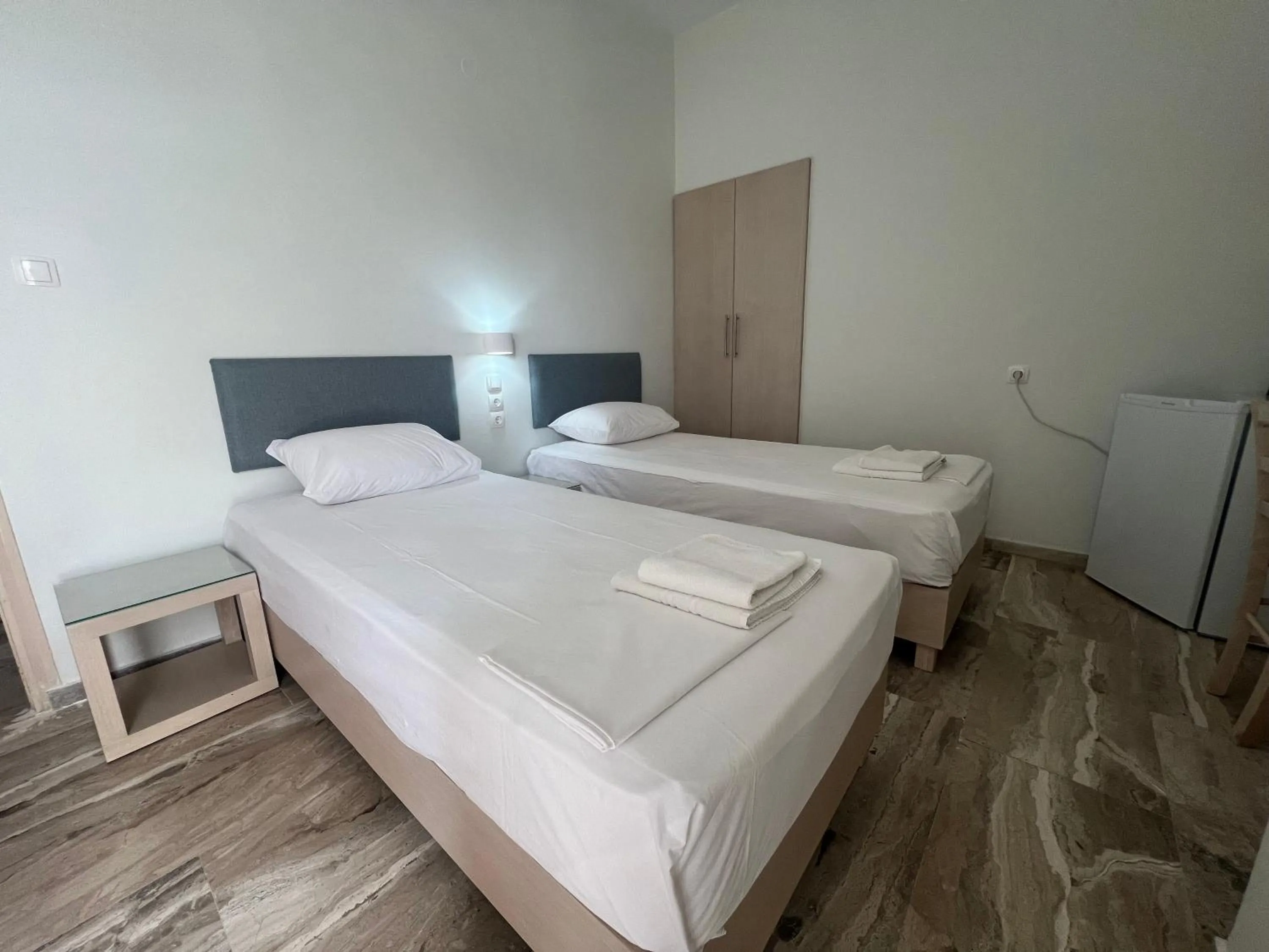 Bed in Neapolis Apartments