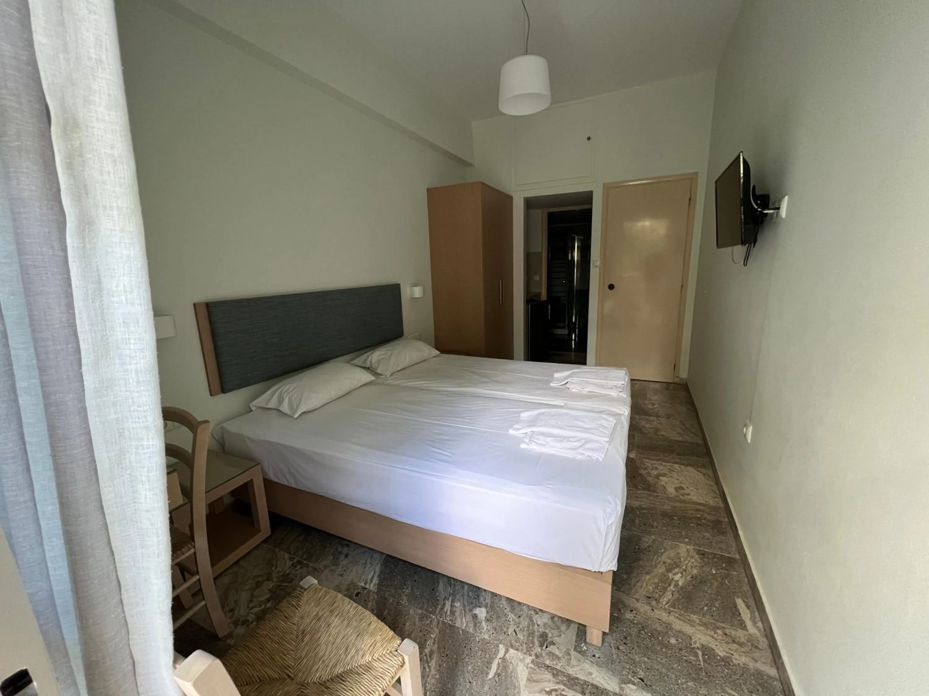 Bed in Neapolis Apartments