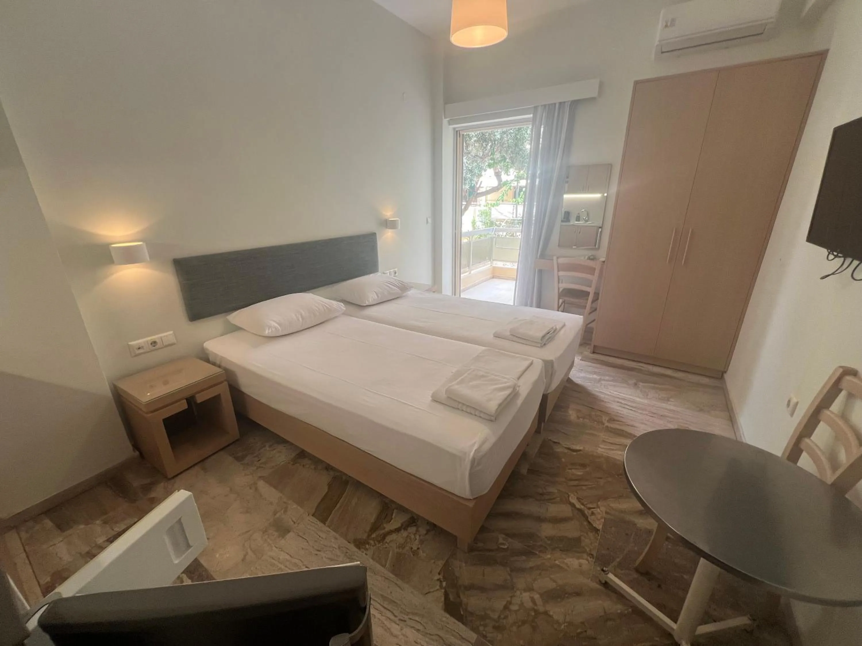 Bed in Neapolis Apartments