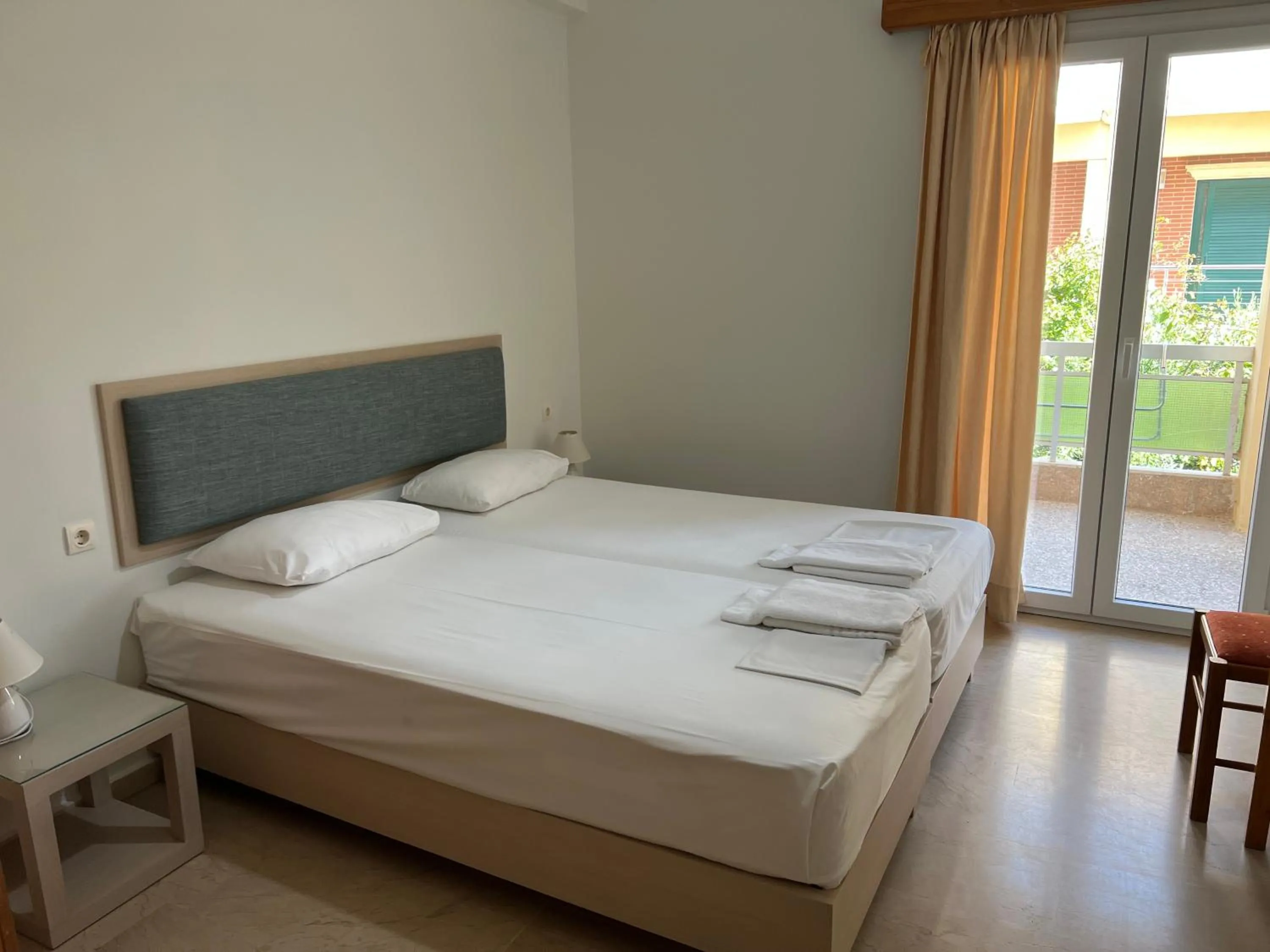 Bed in Neapolis Apartments