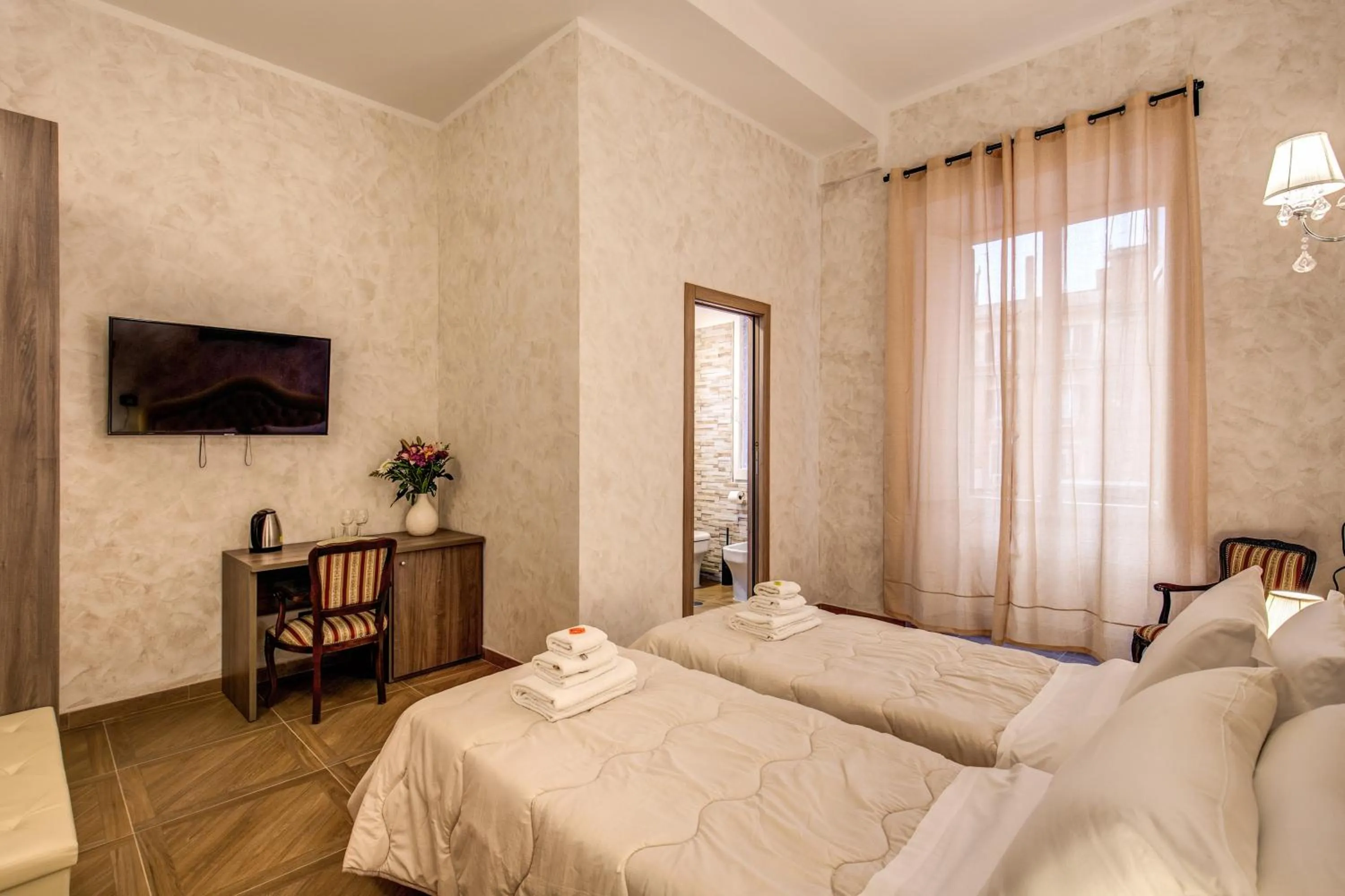 Bed in AMICI GUESTHOUSE