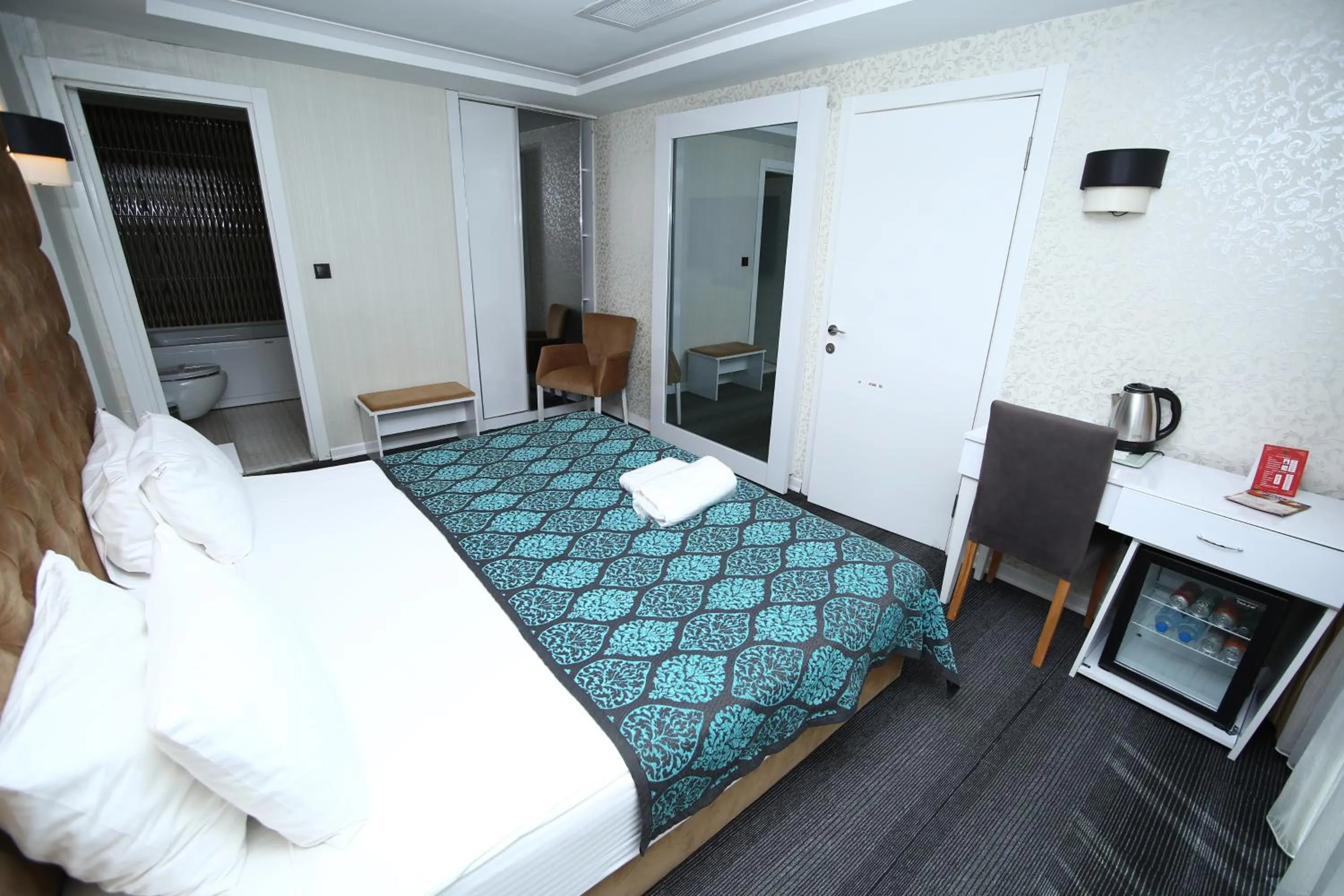 Bed in Grand Silay Hotel