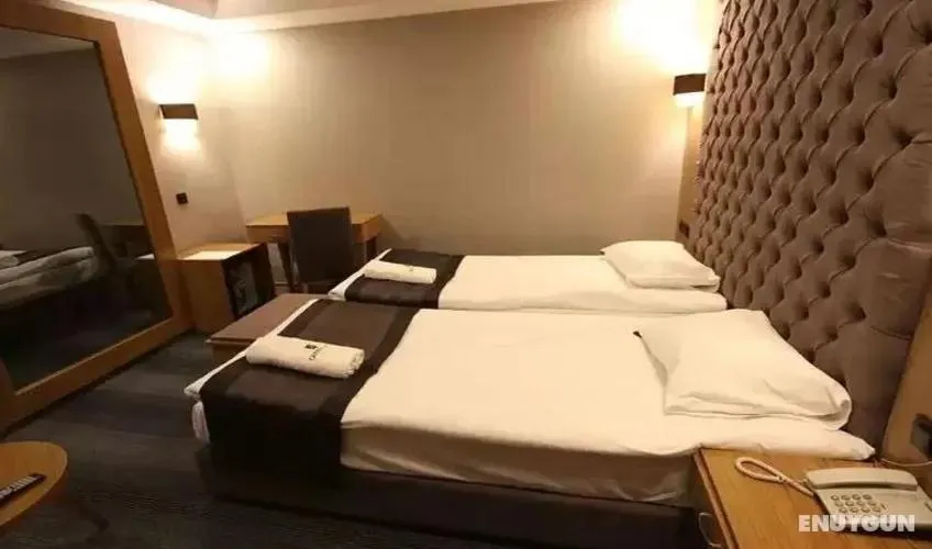 Bed in Grand Silay Hotel